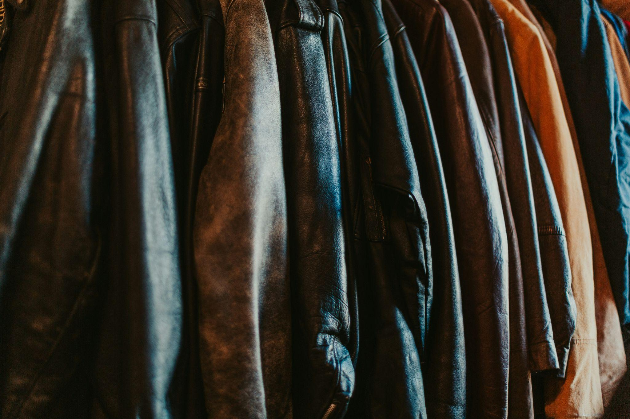 Close-up view of leather jackets showing detailed cuts and texture.