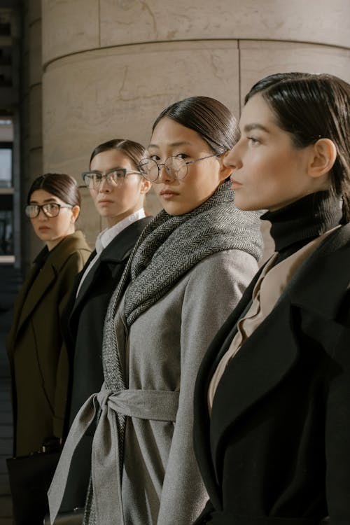 Women in corporate clothes and coats