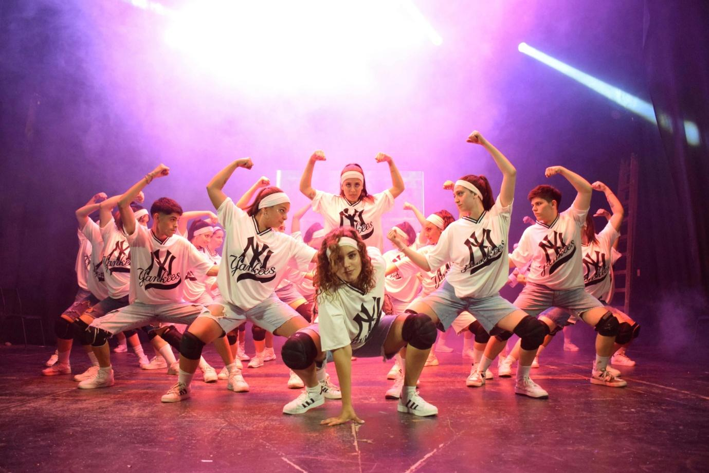 A group of stage dancers wearing uniforms manufactured by Lefty Production Co.