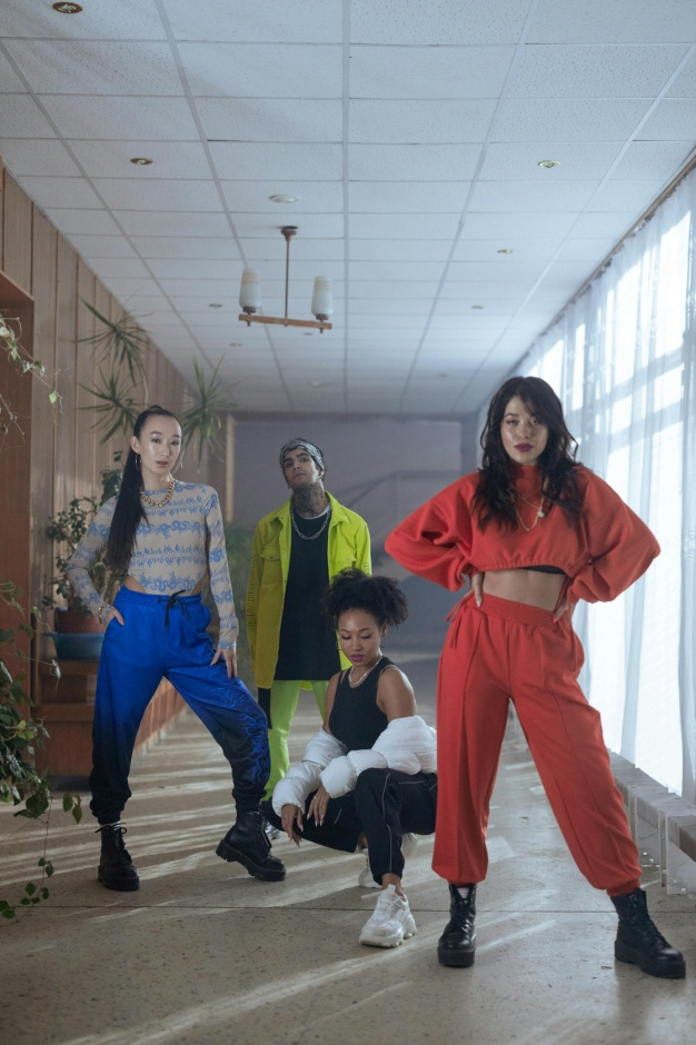 A group of dancers wearing apparel manufactured by Lefty Production Co.