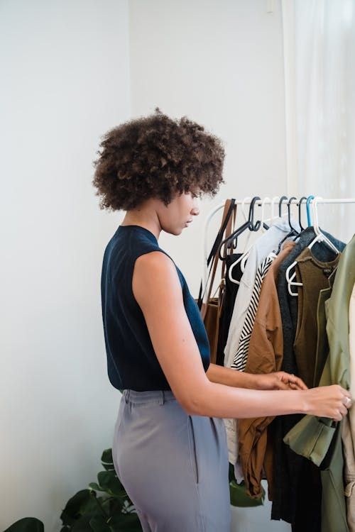 a woman checking out some clothes by Lefty Production Co.