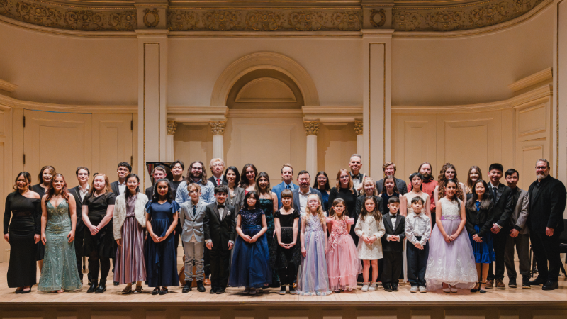group picture of participants at the carnegie hall recital event