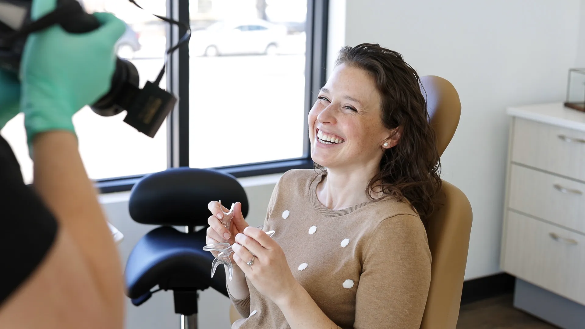 group photo of friends smiling at the beach