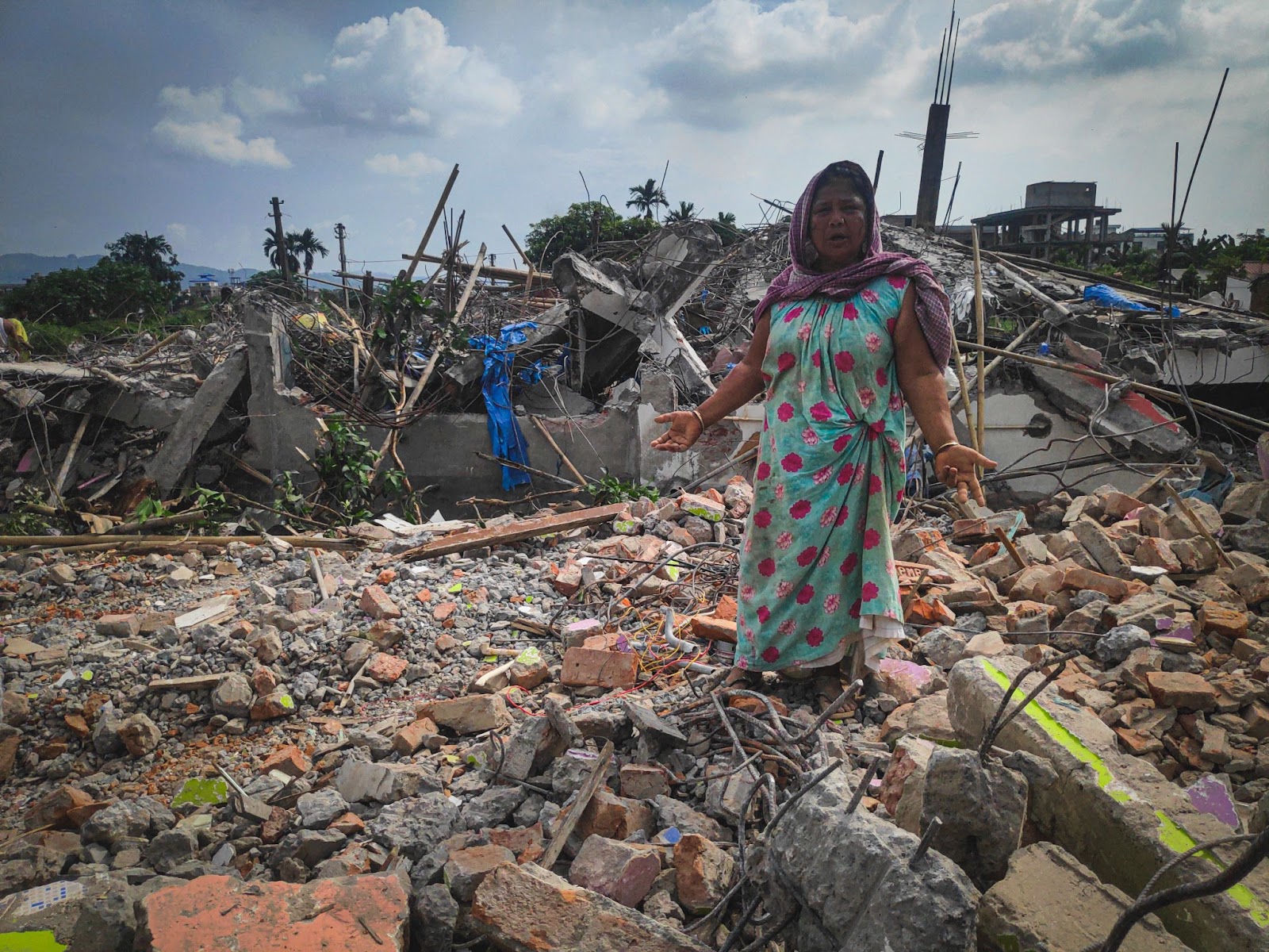 Anwara Begum shows the rubble of her demolished house in Silsako wetland on 12 September.