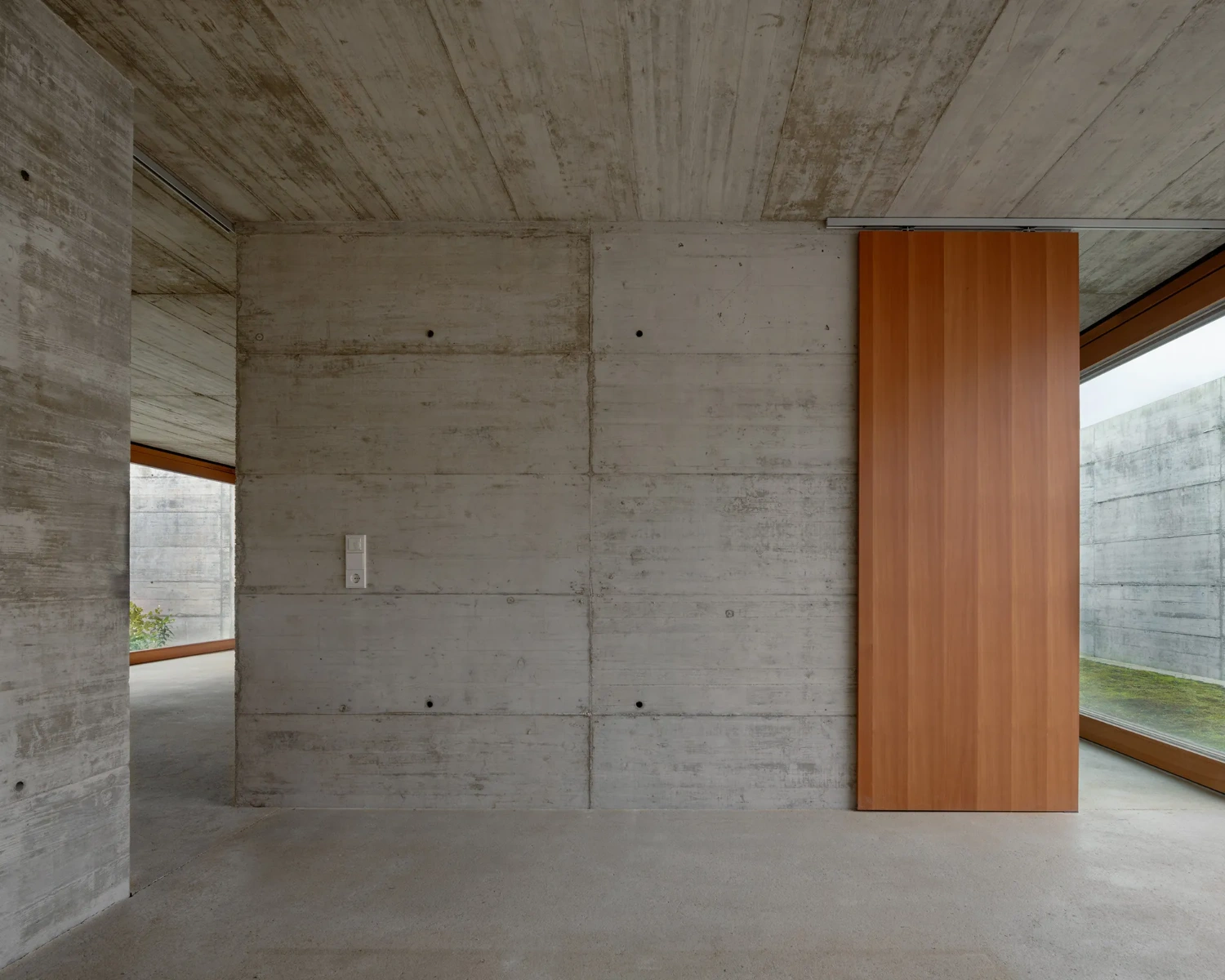 House with two courtyards by BÜRO MÜHLBAUER, concrete architecture, minimalist villa, german architecure, wood