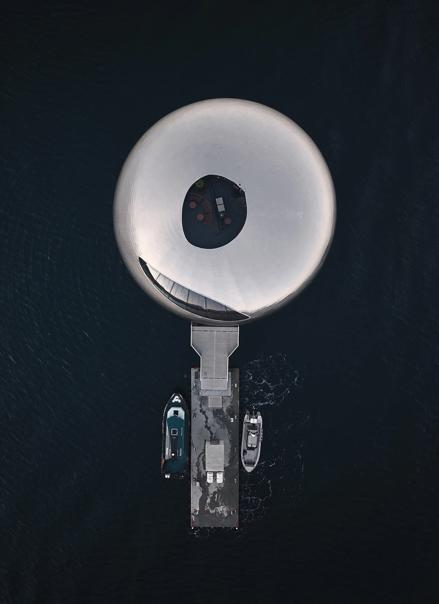 Iris Restaurant interior by Norm Architects inside the Salmon Eye floating structure, Norway Guide, architecture