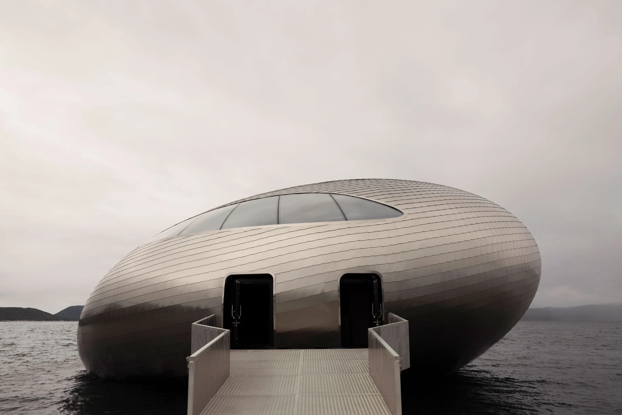 Iris Restaurant interior by Norm Architects inside the Salmon Eye floating structure, Norway Guide, architecture
