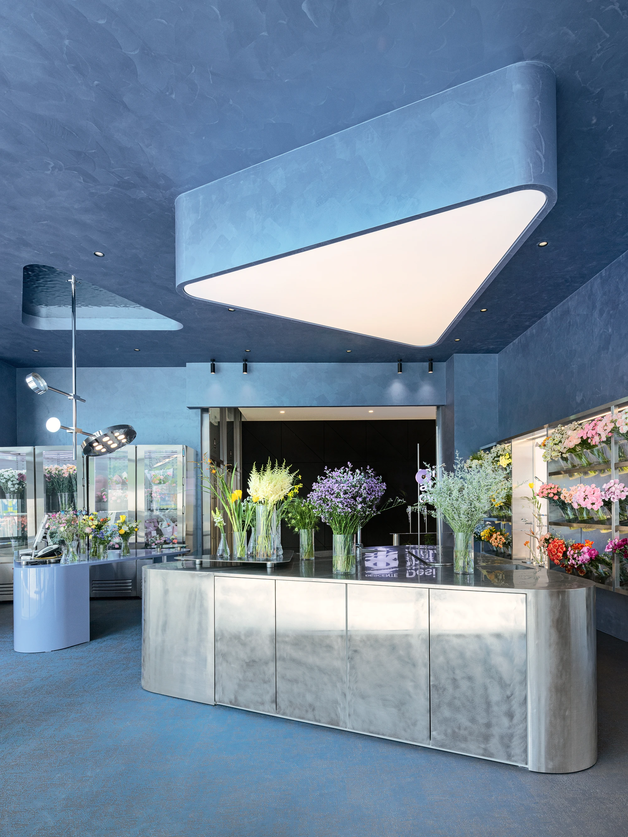 O'flower futuristic florist interior by plainoddity with stainless steel and blue walls, Seoul Guide, interior design