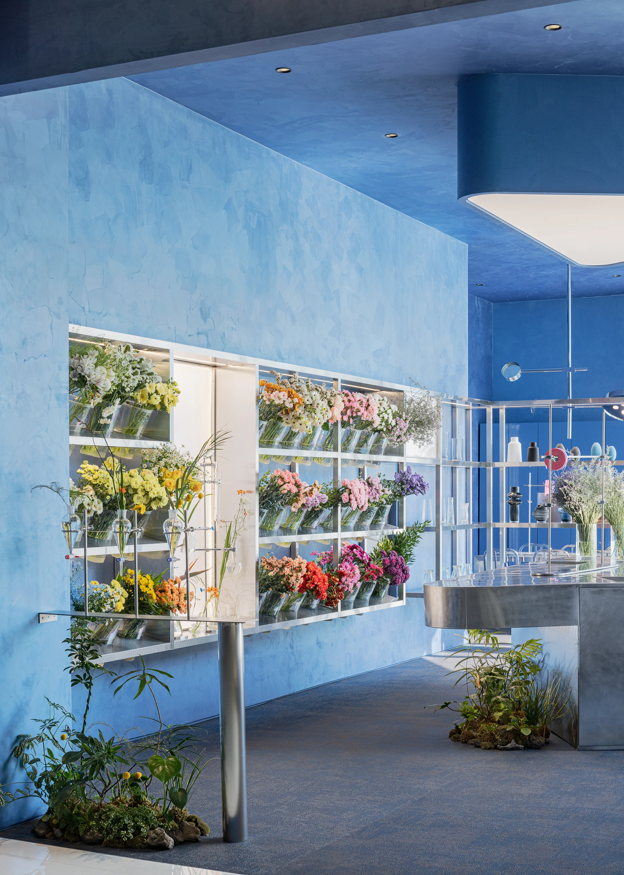 O'flower futuristic florist interior by plainoddity with stainless steel and blue walls, Seoul Guide, interior design