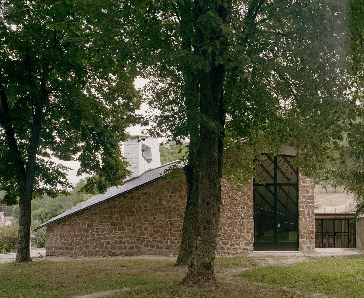 Church of Cserépváralja restoration showing stone walls and new concrete ramp, sacral architecture, Hungary