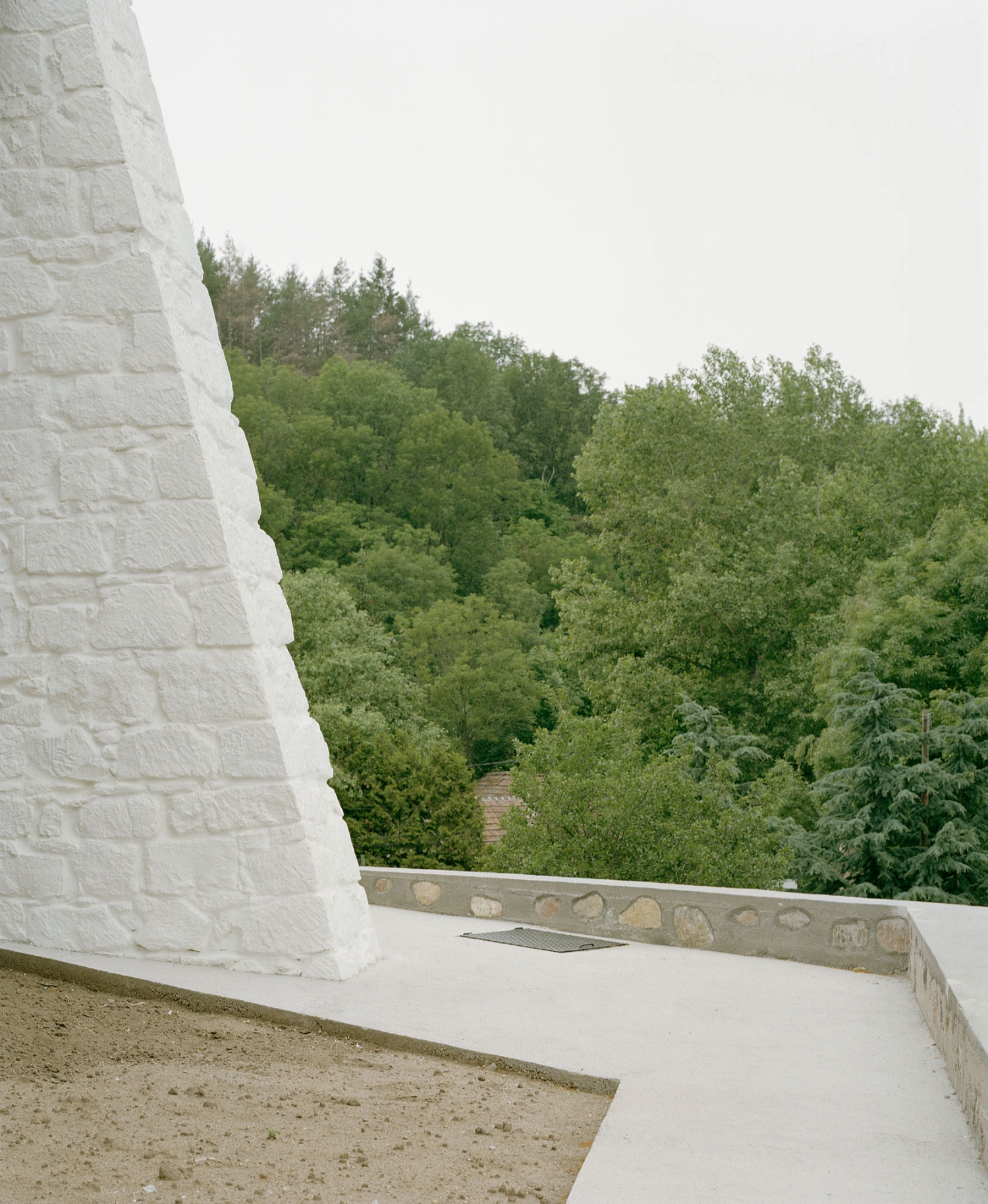 Church of Cserépváralja restoration showing stone walls and new concrete ramp, sacral architecture, Hungary