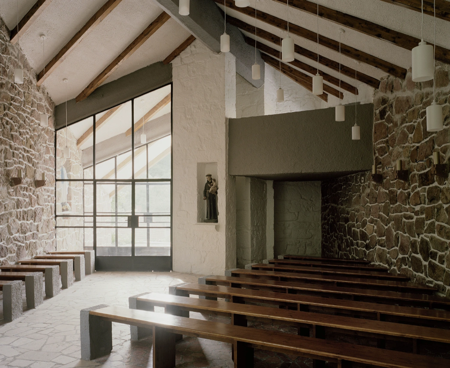 Church of Cserépváralja restoration showing stone walls and new concrete ramp, sacral architecture, Hungary