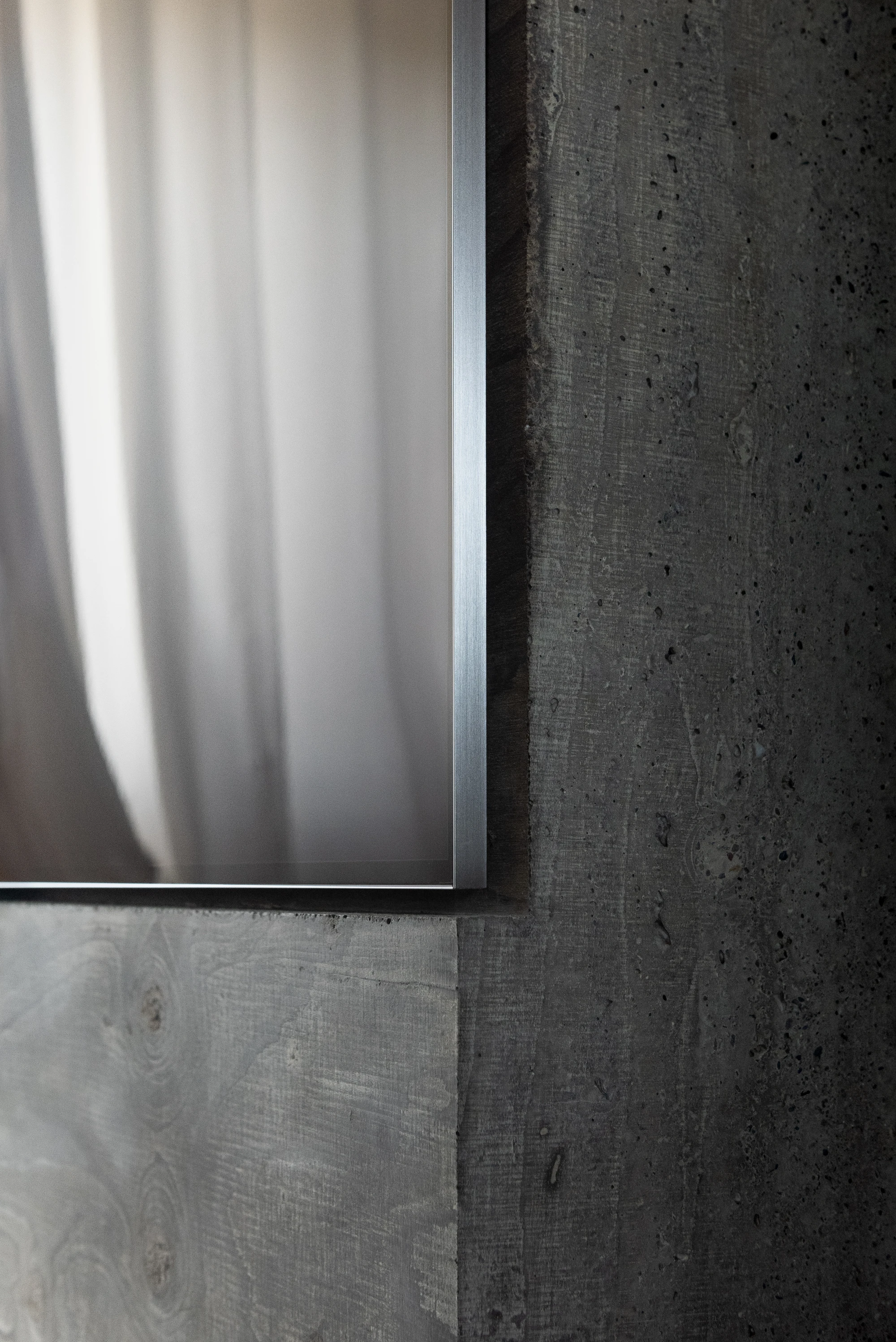 Concrete TV Stand sculptural media furniture by David Bard with meteorite-like base