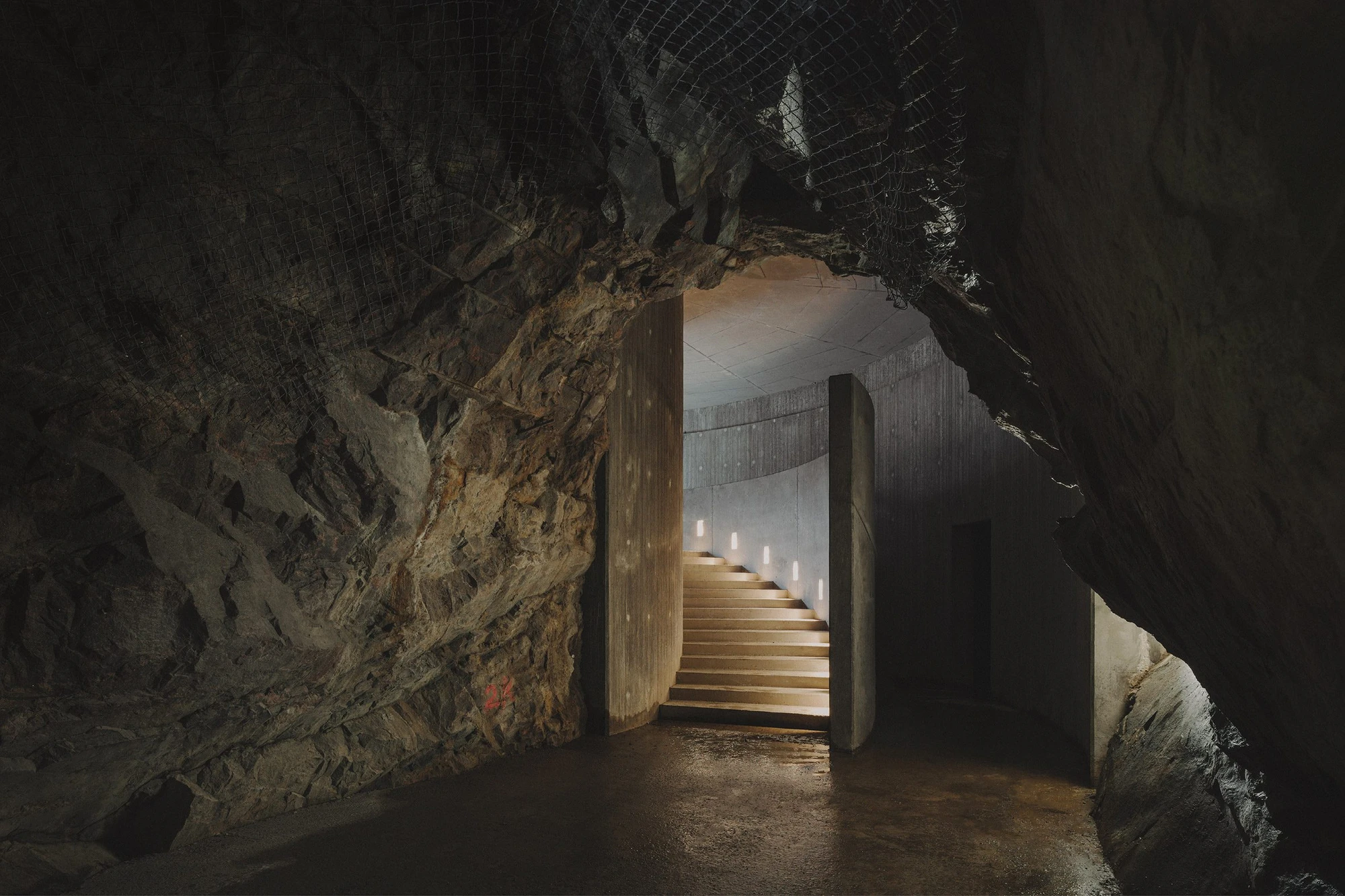 The Mountain Chamber by Erdegard Arkitekter, Gothenburg, Sweden Guide, cave entrance, monolithic architecture, metal facade