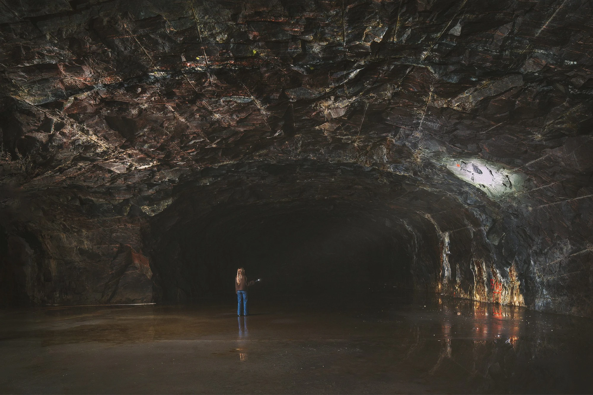 The Mountain Chamber by Erdegard Arkitekter, Gothenburg, Sweden Guide, cave entrance, monolithic architecture, metal facade