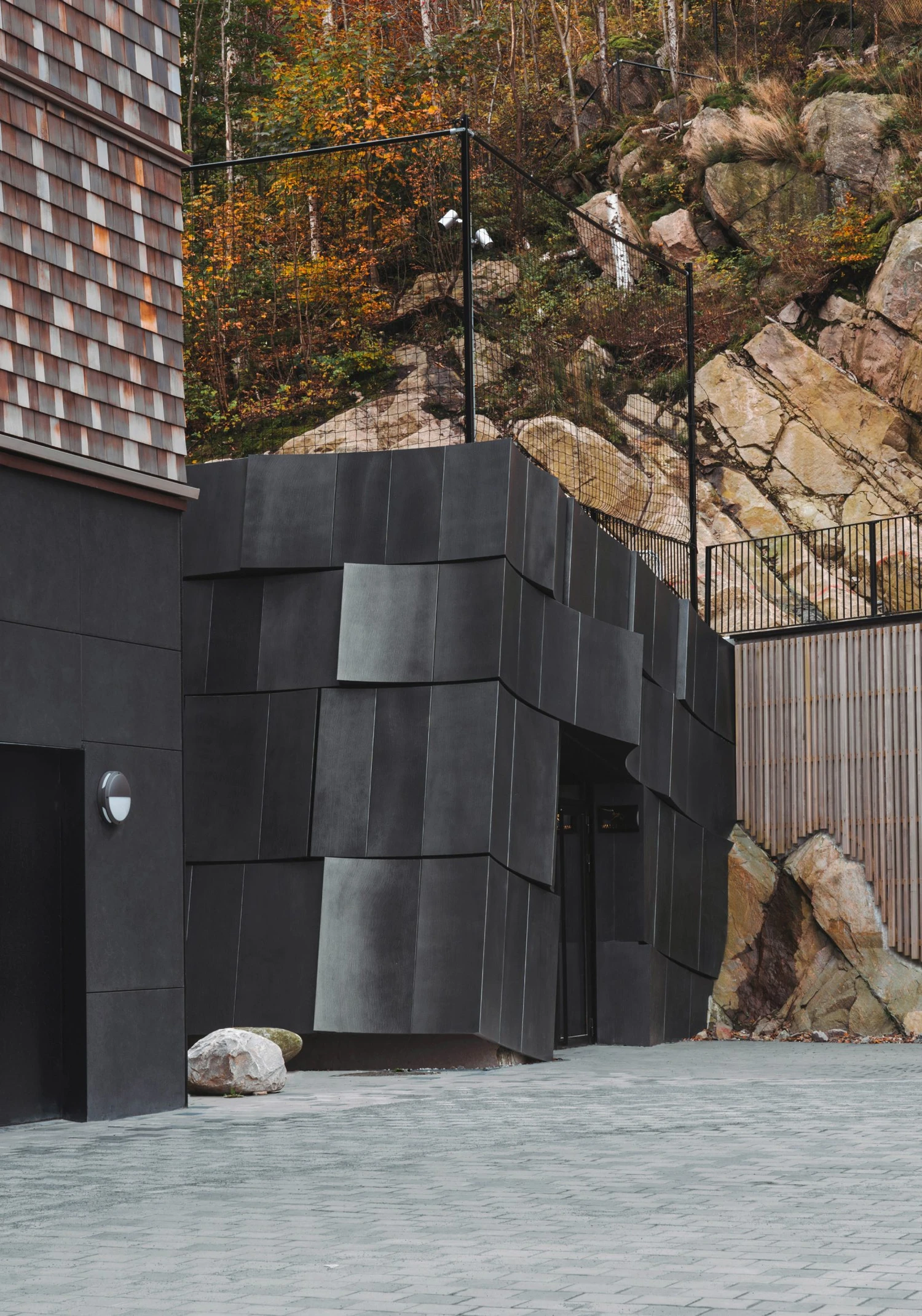 The Mountain Chamber by Erdegard Arkitekter, Gothenburg, Sweden Guide, cave entrance, monolithic architecture, metal facade
