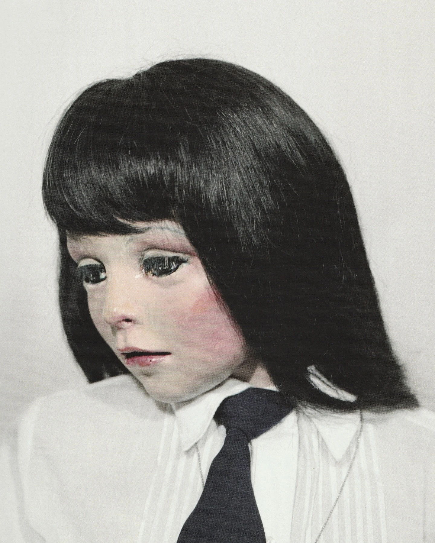 40 Portraits 2003-2008 by Gisèle Vienne, handcrafted doll portrait with pale skin and glazed eyes, contemporary art photography and sculpture