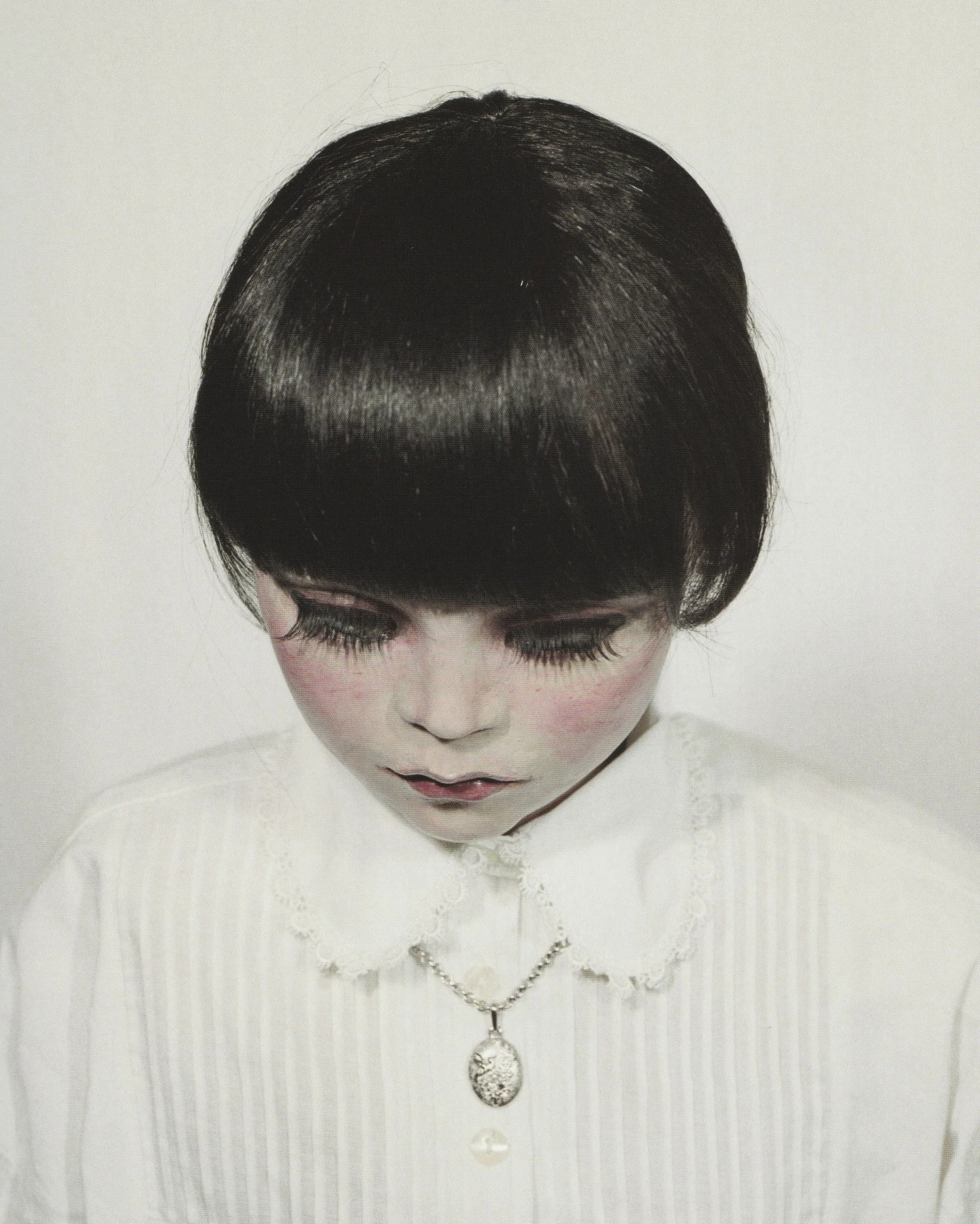 40 Portraits 2003-2008 by Gisèle Vienne, handcrafted doll portrait with pale skin and glazed eyes, contemporary art photography and sculpture