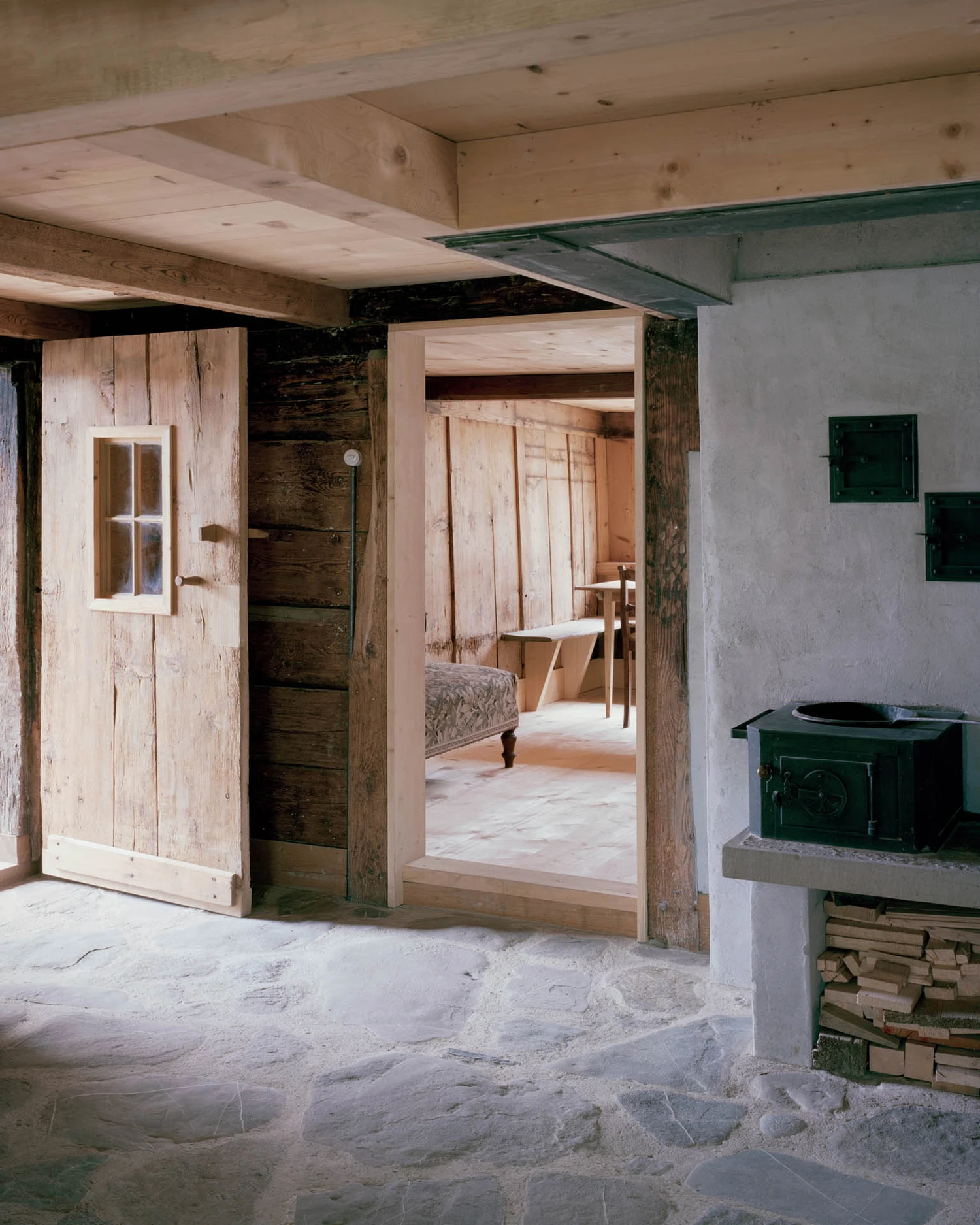 The Gässli5 by allen + crippa architektur in Werdenberg Switzerland, rammed-earth and historic log house with permaculture garden, sustainable circular architecture