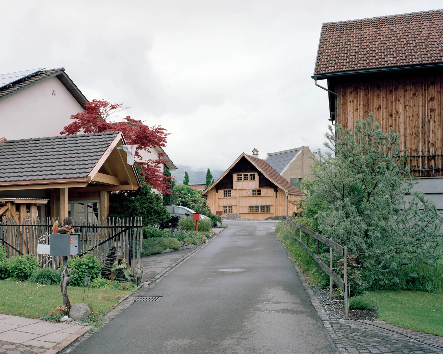 The Gässli5 by allen + crippa architektur in Werdenberg Switzerland, rammed-earth and historic log house with permaculture garden, sustainable circular architecture