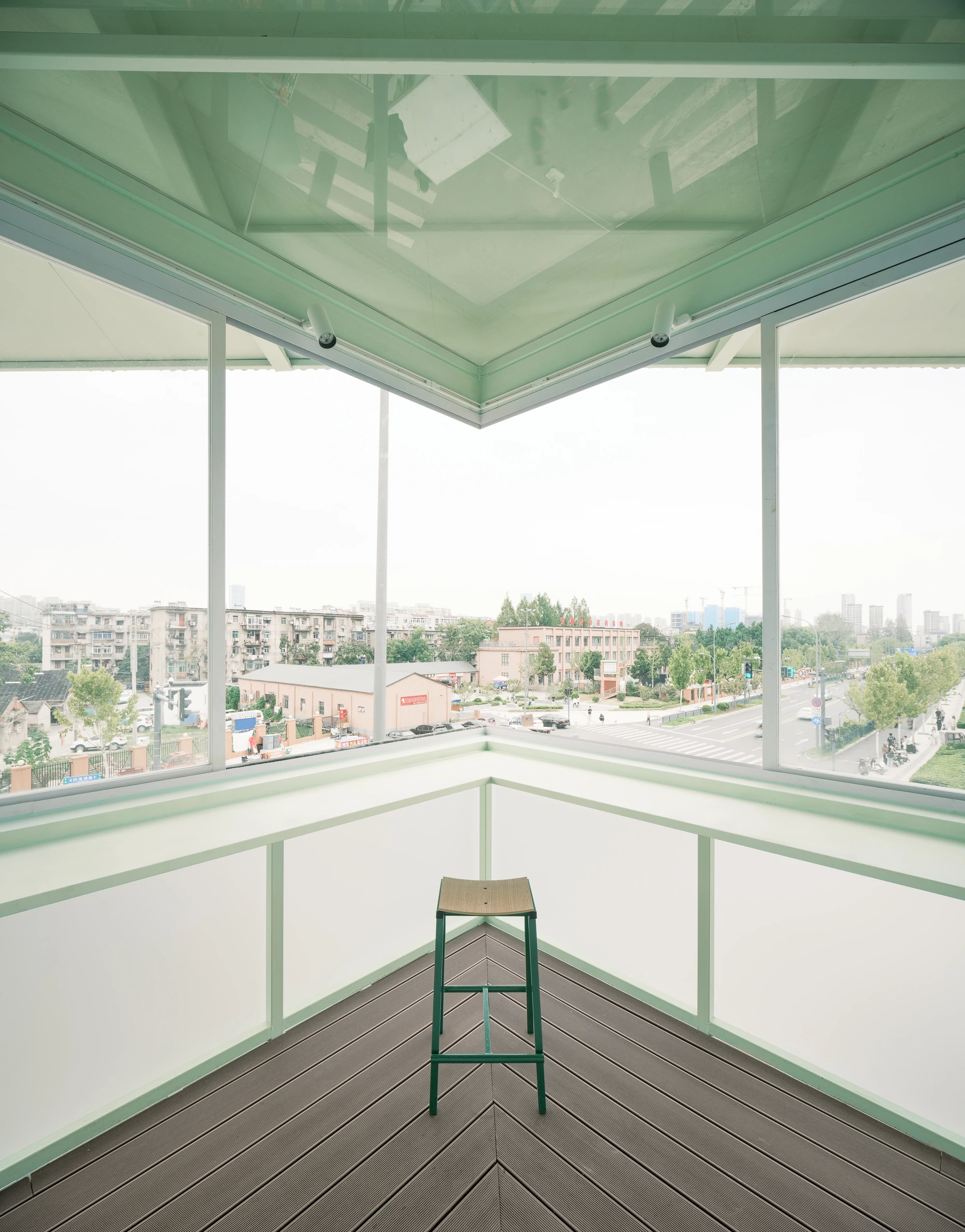 A Very Small 24-hour Bookstore by SZ-Architects in Hefei China, adaptive reuse guard tower converted to public reading space, suspended steel structure with four-leaf clover roof