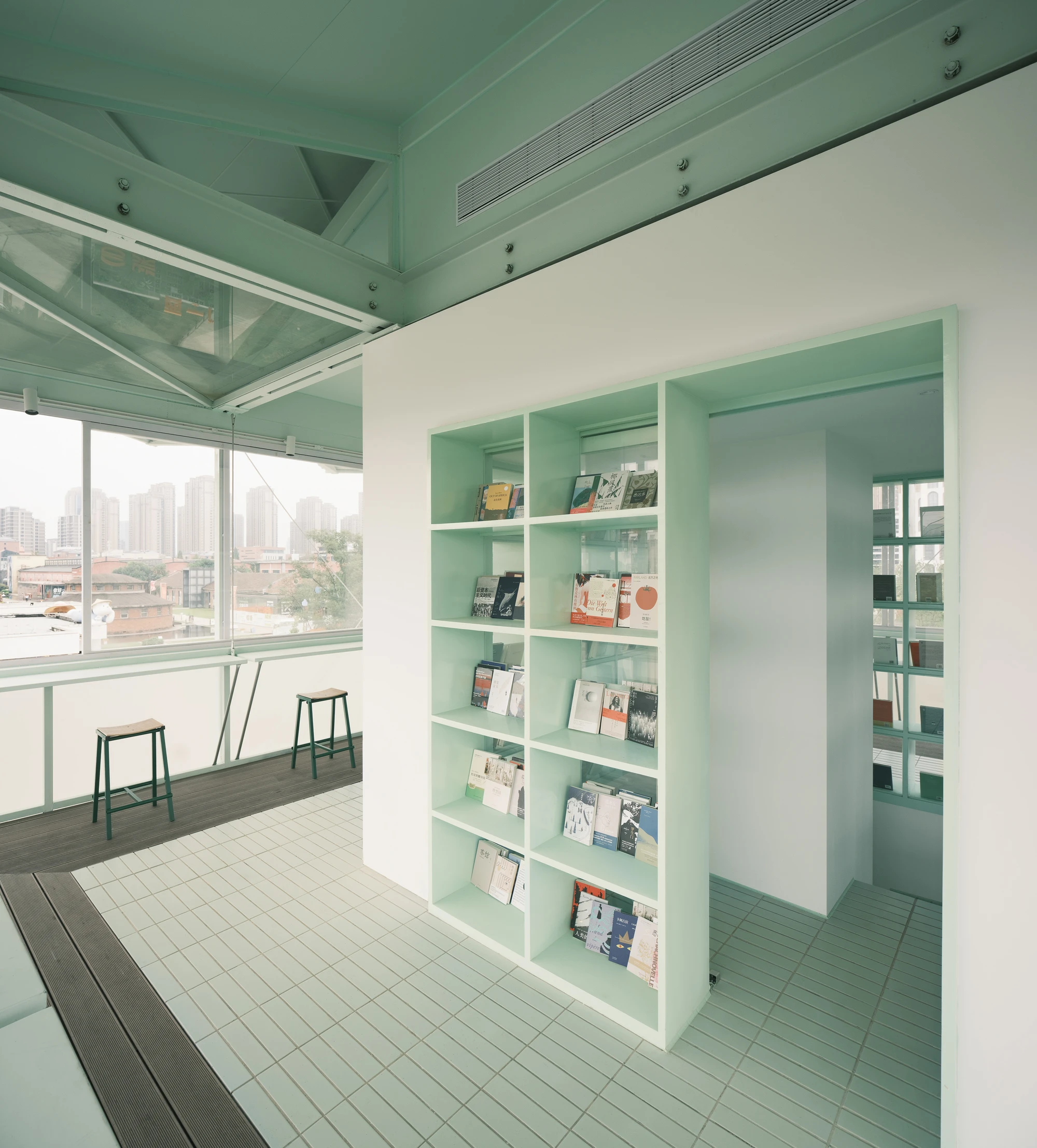 A Very Small 24-hour Bookstore by SZ-Architects in Hefei China, adaptive reuse guard tower converted to public reading space, suspended steel structure with four-leaf clover roof