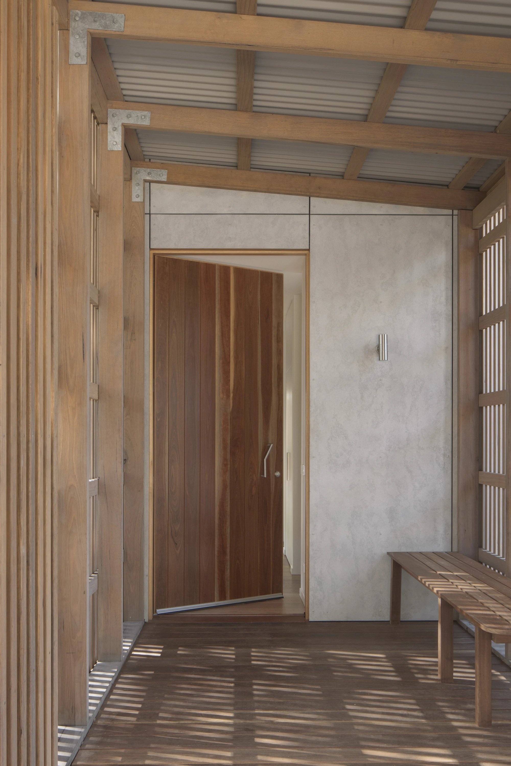 First House Past the Trees by Josh Cole WORKCRAFT in Barwon Heads Australia, residential architecture built around protected Moonah trees with fibre-cement and timber batten screens