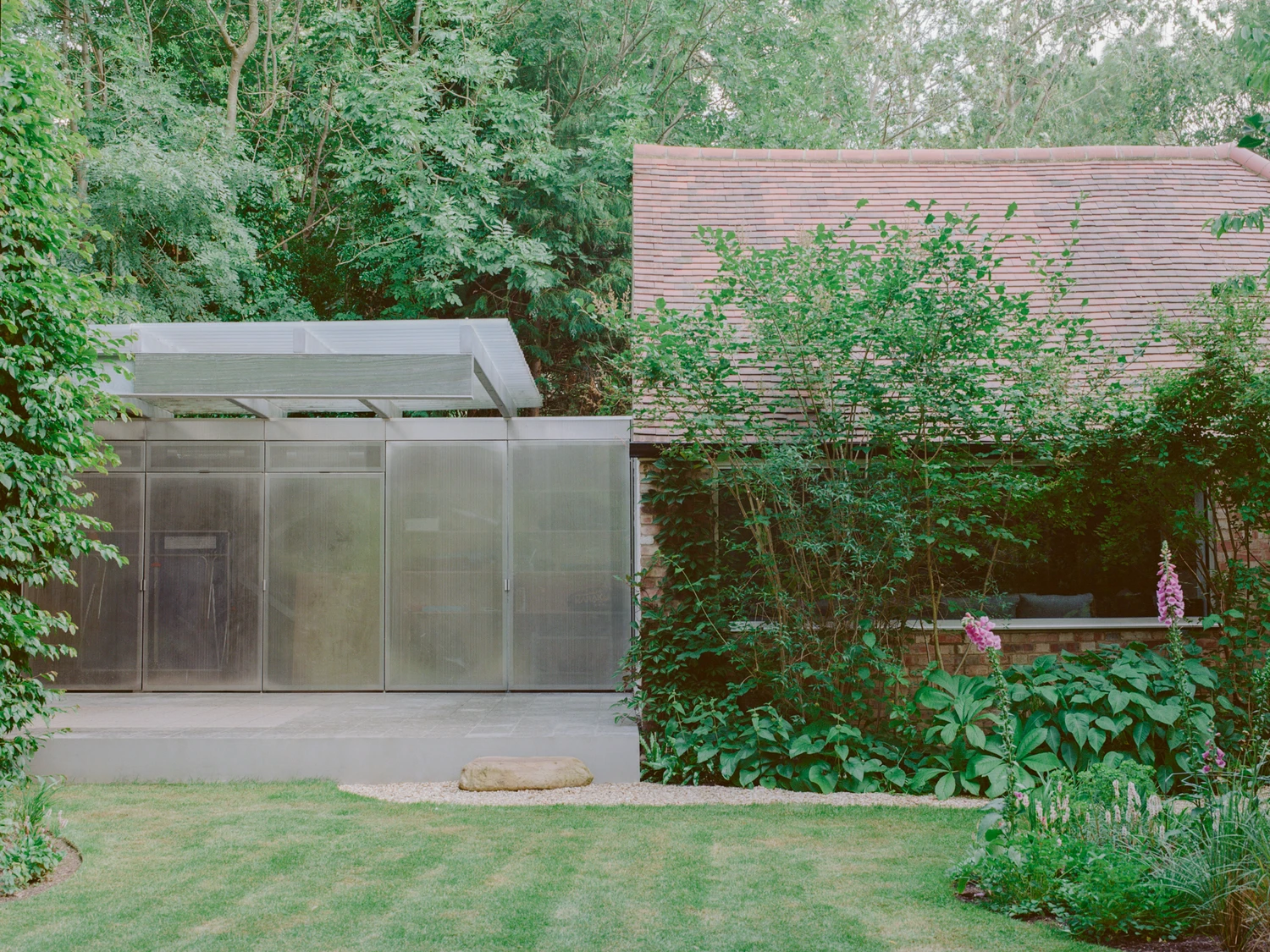 Exeter Road Pavilion by Neiheiser Argyros in London UK, adaptive reuse Victorian outbuilding with perforated stainless steel cabinet marble counterweight and Fischli Weiss inspired structural precarity