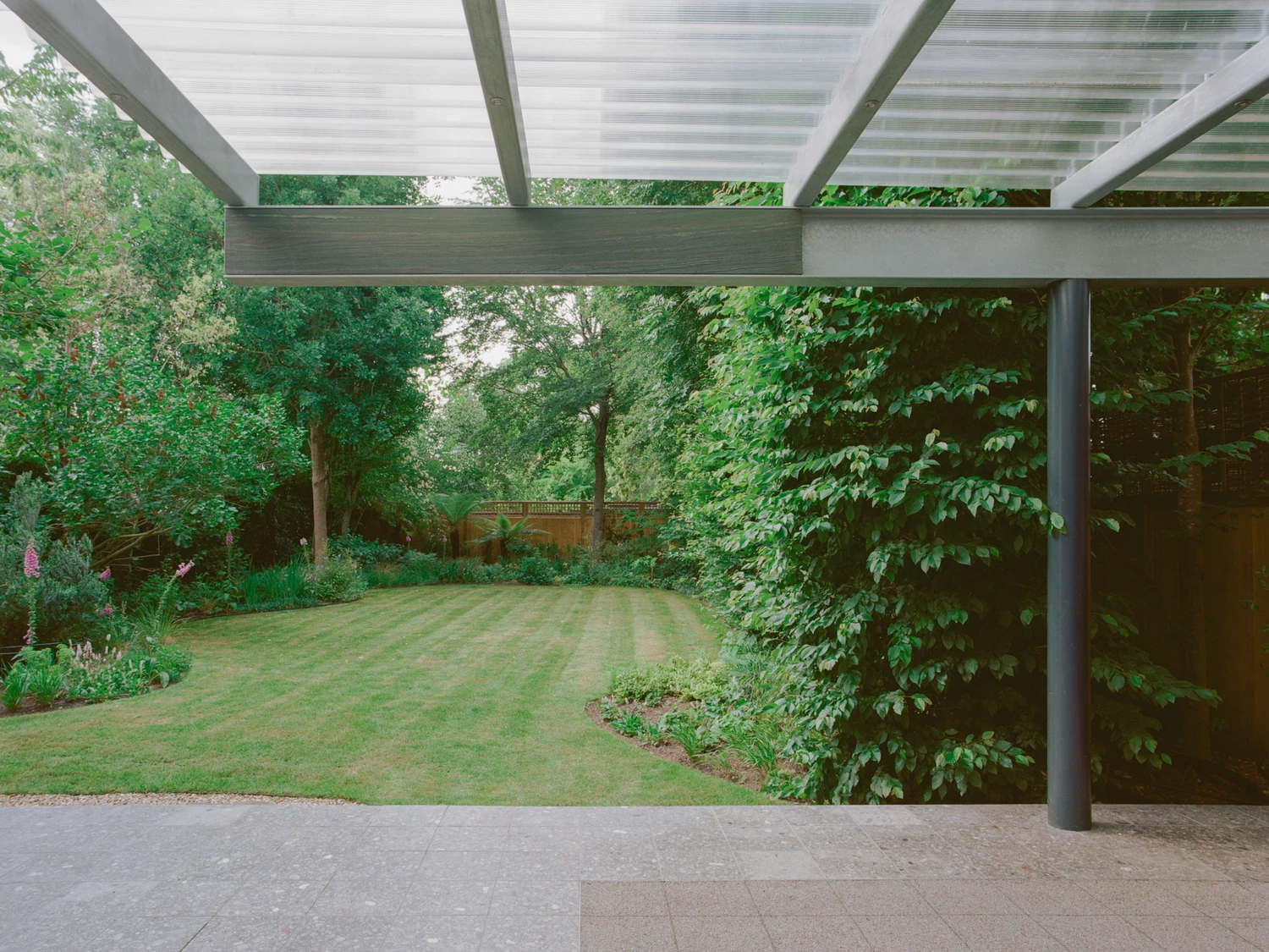 Exeter Road Pavilion by Neiheiser Argyros in London UK, adaptive reuse Victorian outbuilding with perforated stainless steel cabinet marble counterweight and Fischli Weiss inspired structural precarity