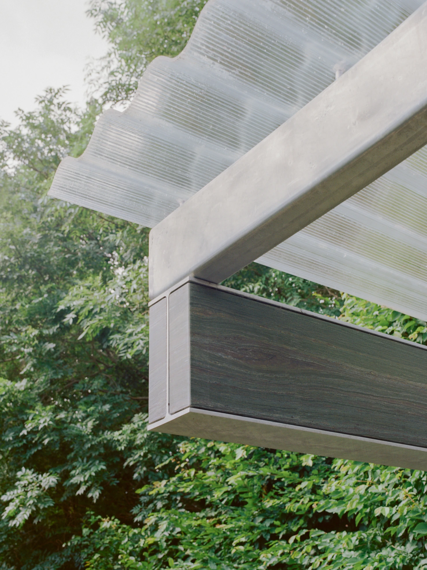 Exeter Road Pavilion by Neiheiser Argyros in London UK, adaptive reuse Victorian outbuilding with perforated stainless steel cabinet marble counterweight and Fischli Weiss inspired structural precarity