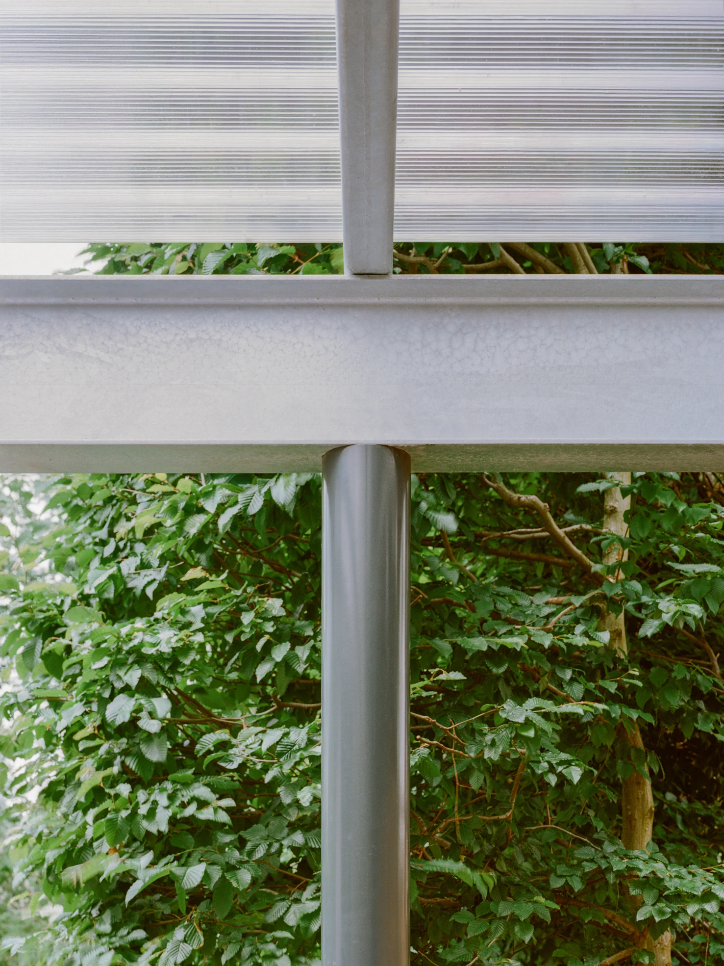 Exeter Road Pavilion by Neiheiser Argyros in London UK, adaptive reuse Victorian outbuilding with perforated stainless steel cabinet marble counterweight and Fischli Weiss inspired structural precarity