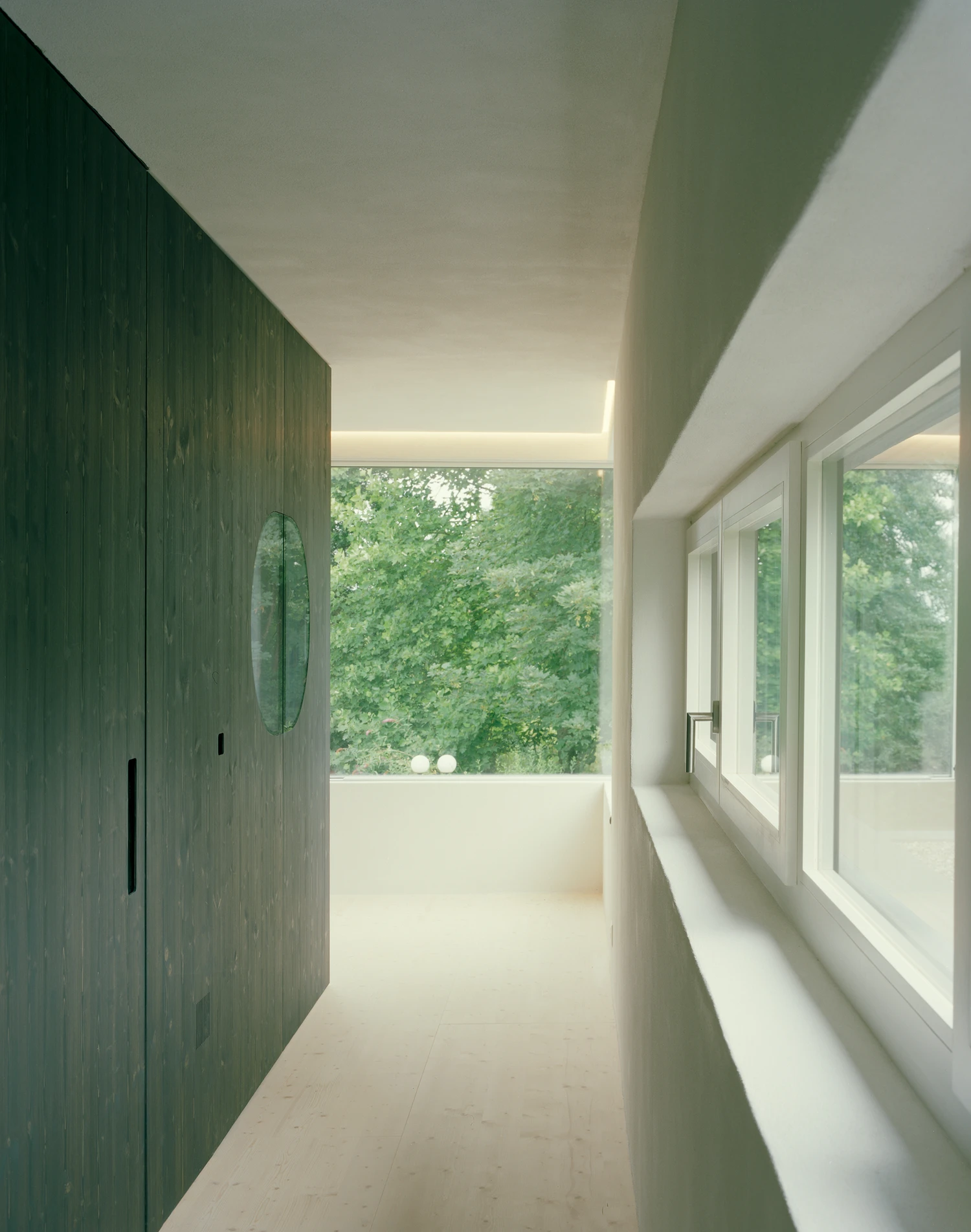 Attic Conversion in Riehen by Raeto Studer Architekten near Basel Switzerland, 1969 house renovation with black oiled cupboards soundproofed studio box clay plaster and PV roof