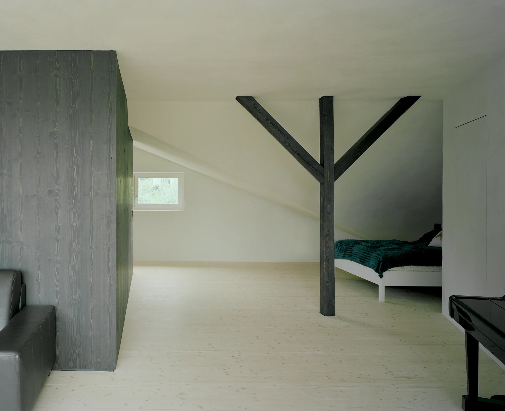 Attic Conversion in Riehen by Raeto Studer Architekten near Basel Switzerland, 1969 house renovation with black oiled cupboards soundproofed studio box clay plaster and PV roof