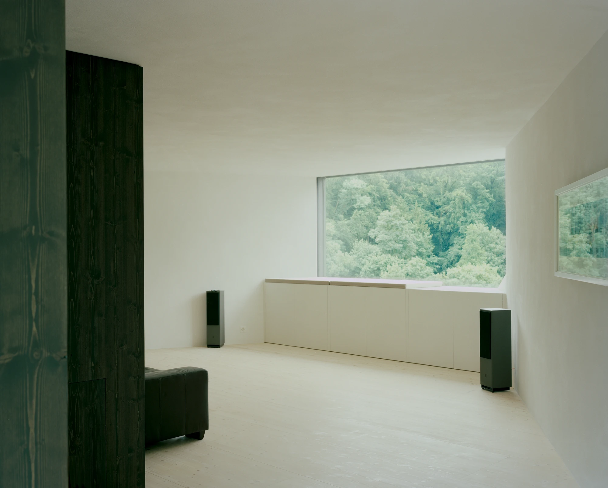 Attic Conversion in Riehen by Raeto Studer Architekten near Basel Switzerland, 1969 house renovation with black oiled cupboards soundproofed studio box clay plaster and PV roof