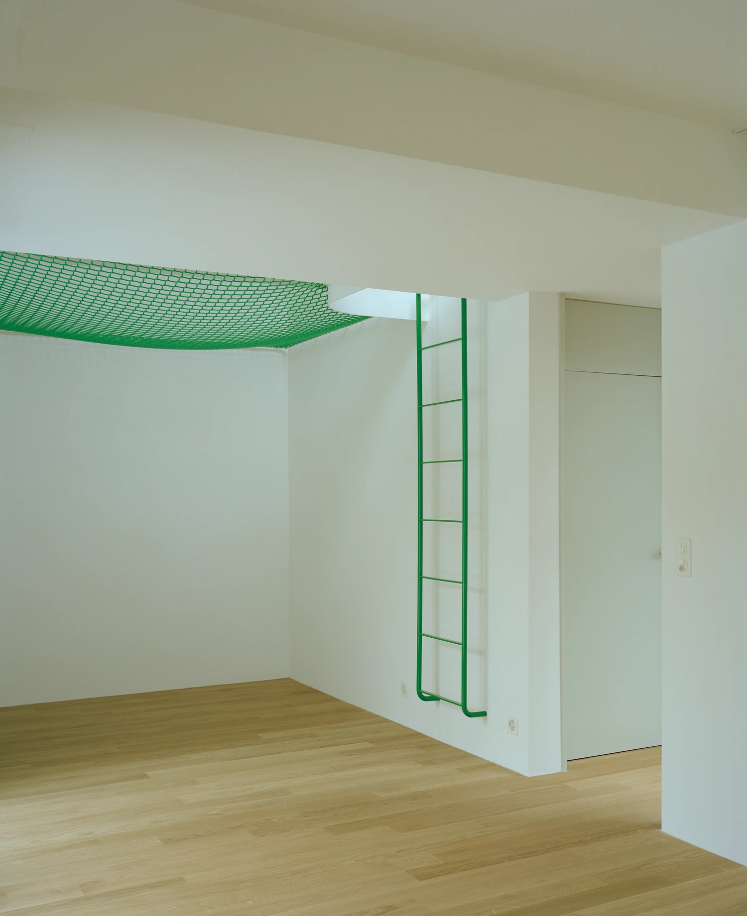 Kirschbaumweg renovation by Staehelin Meyer Architektur in Bottmingen Basel Switzerland, 1990s house with timber upper floor pink green colour scheme spiral staircase and lounger net