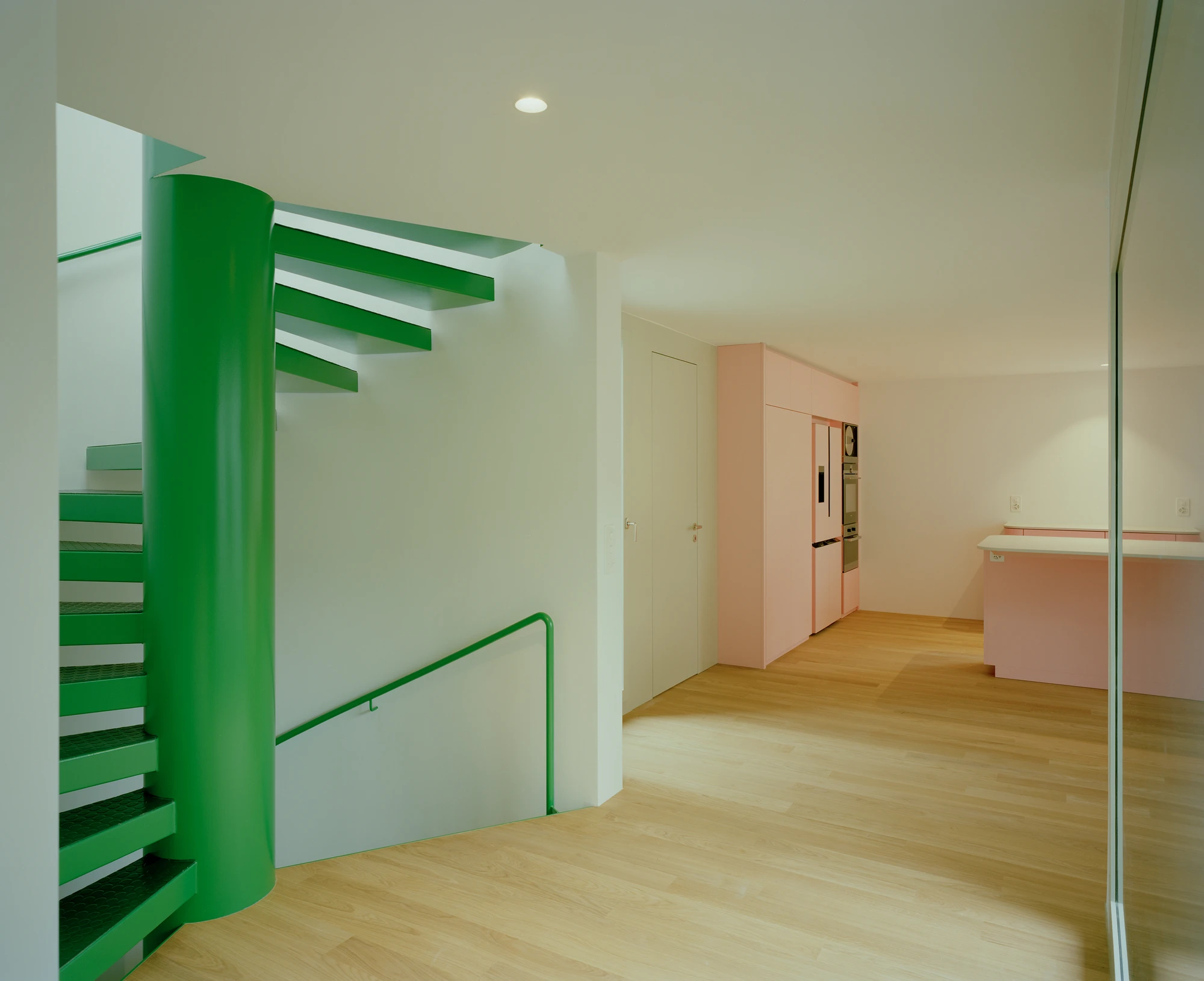 Kirschbaumweg renovation by Staehelin Meyer Architektur in Bottmingen Basel Switzerland, 1990s house with timber upper floor pink green colour scheme spiral staircase and lounger net