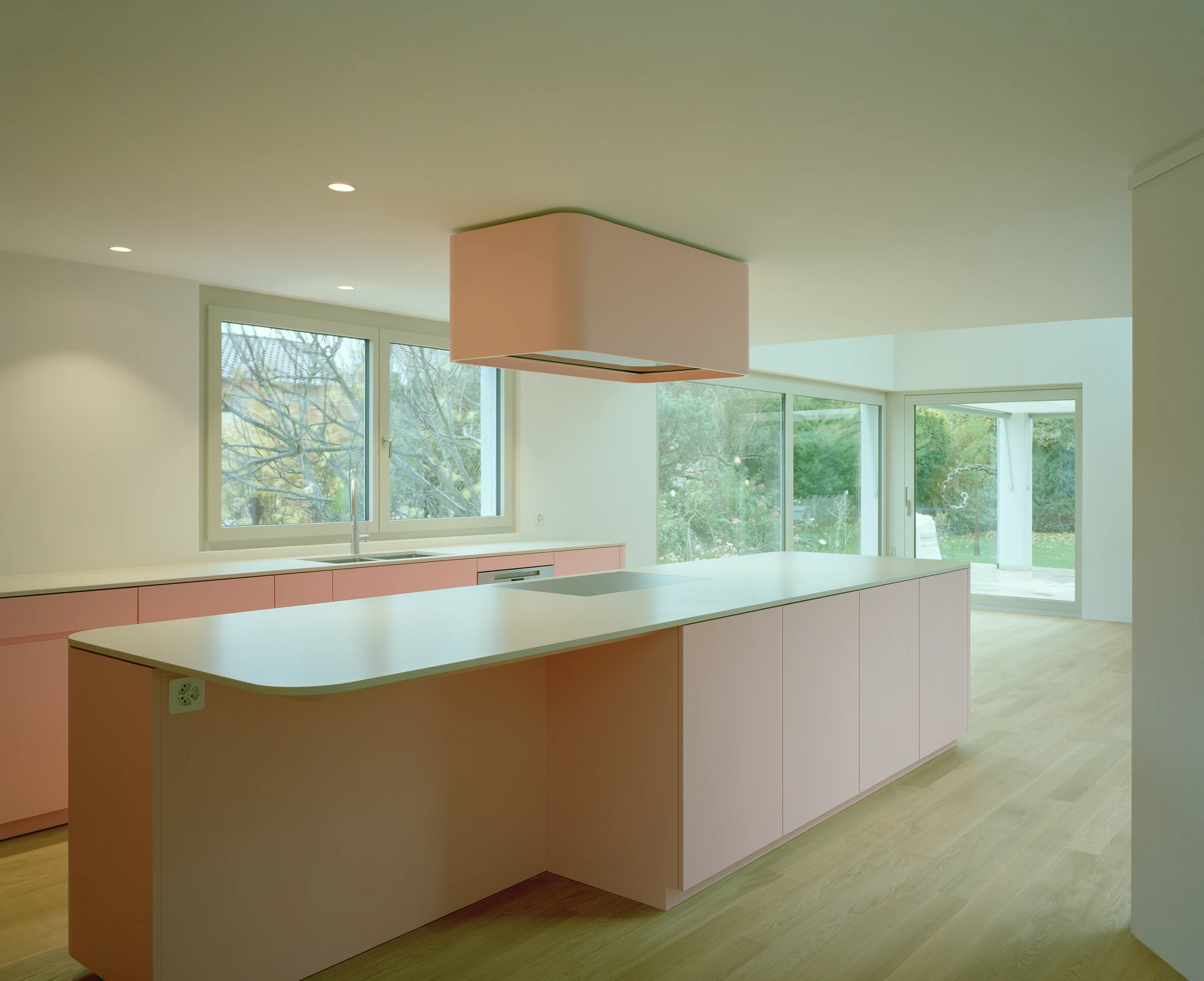 Kirschbaumweg renovation by Staehelin Meyer Architektur in Bottmingen Basel Switzerland, 1990s house with timber upper floor pink green colour scheme spiral staircase and lounger net