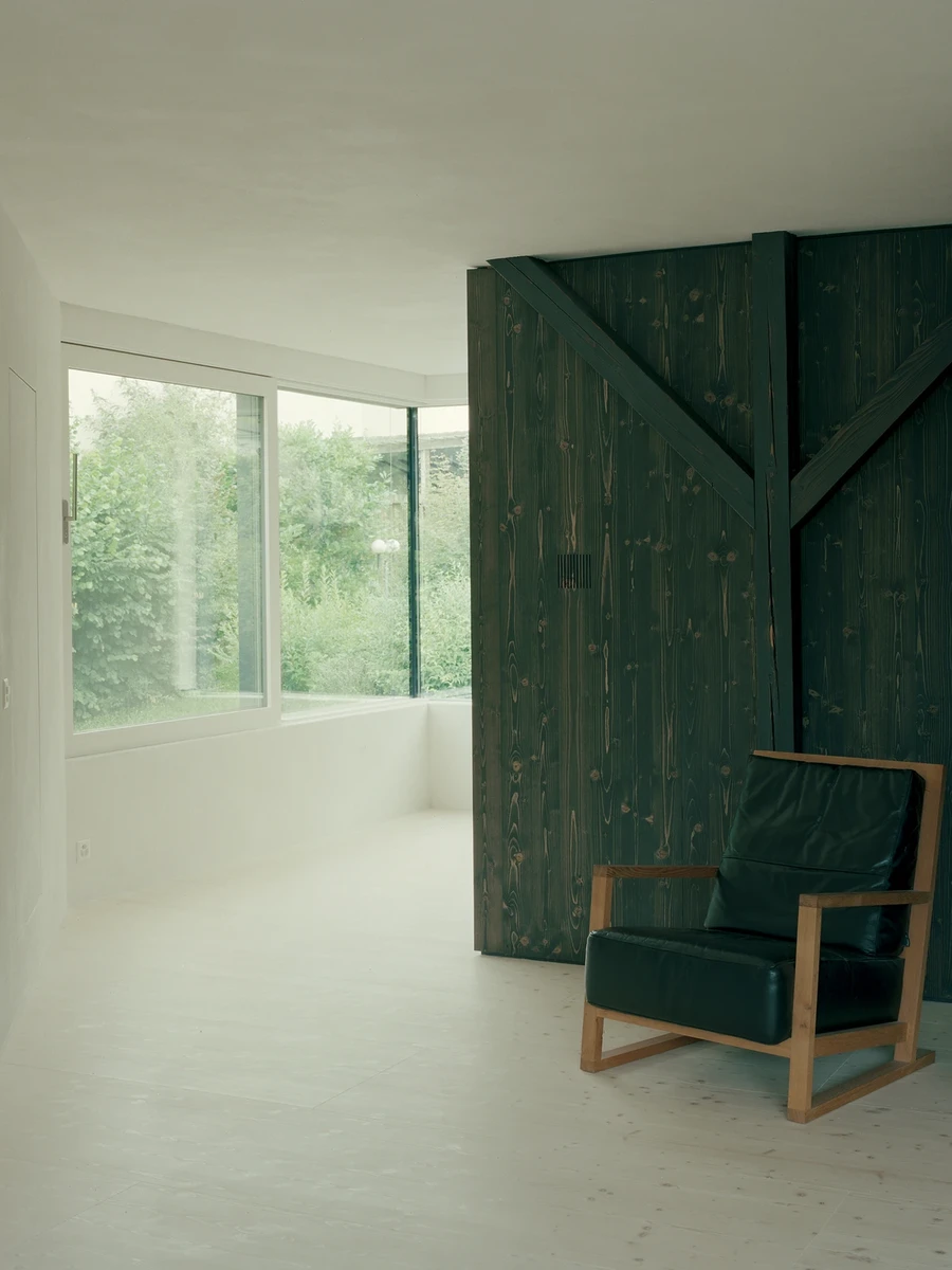 Attic Conversion in Riehen by Raeto Studer Architekten near Basel Switzerland, 1969 house renovation with black oiled cupboards soundproofed studio box clay plaster and PV roof