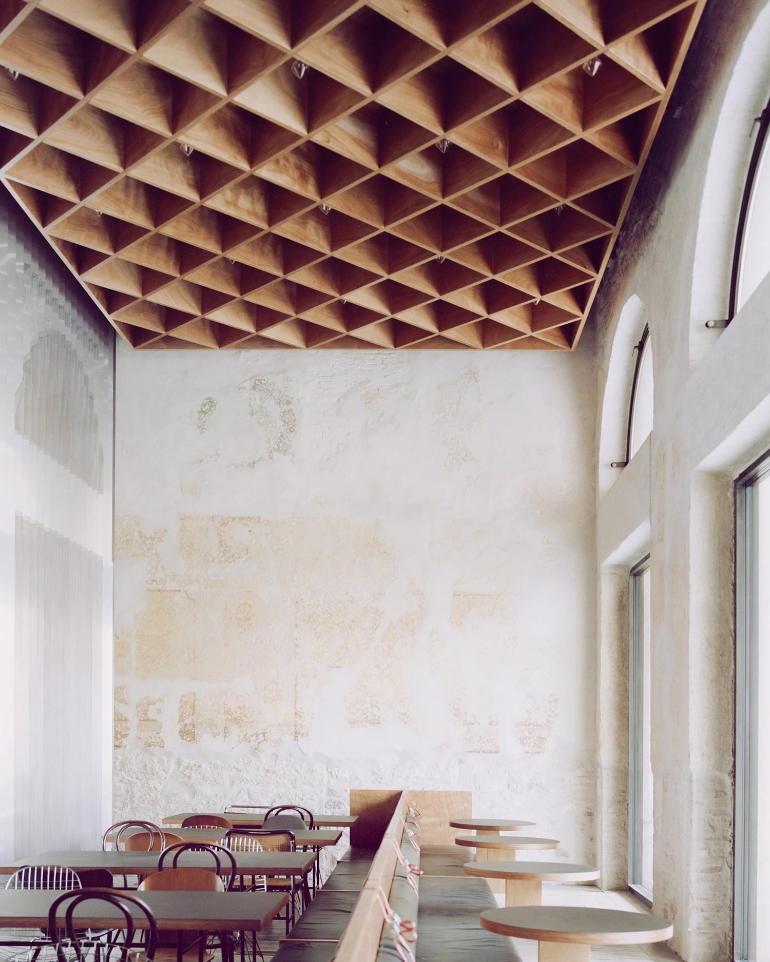 Caffè Nazionale by AMAA in Arzignano Italy, adaptive reuse of 19th-century palazzo with pleated stainless steel walls, okumè plywood ceiling and preserved historical patinas