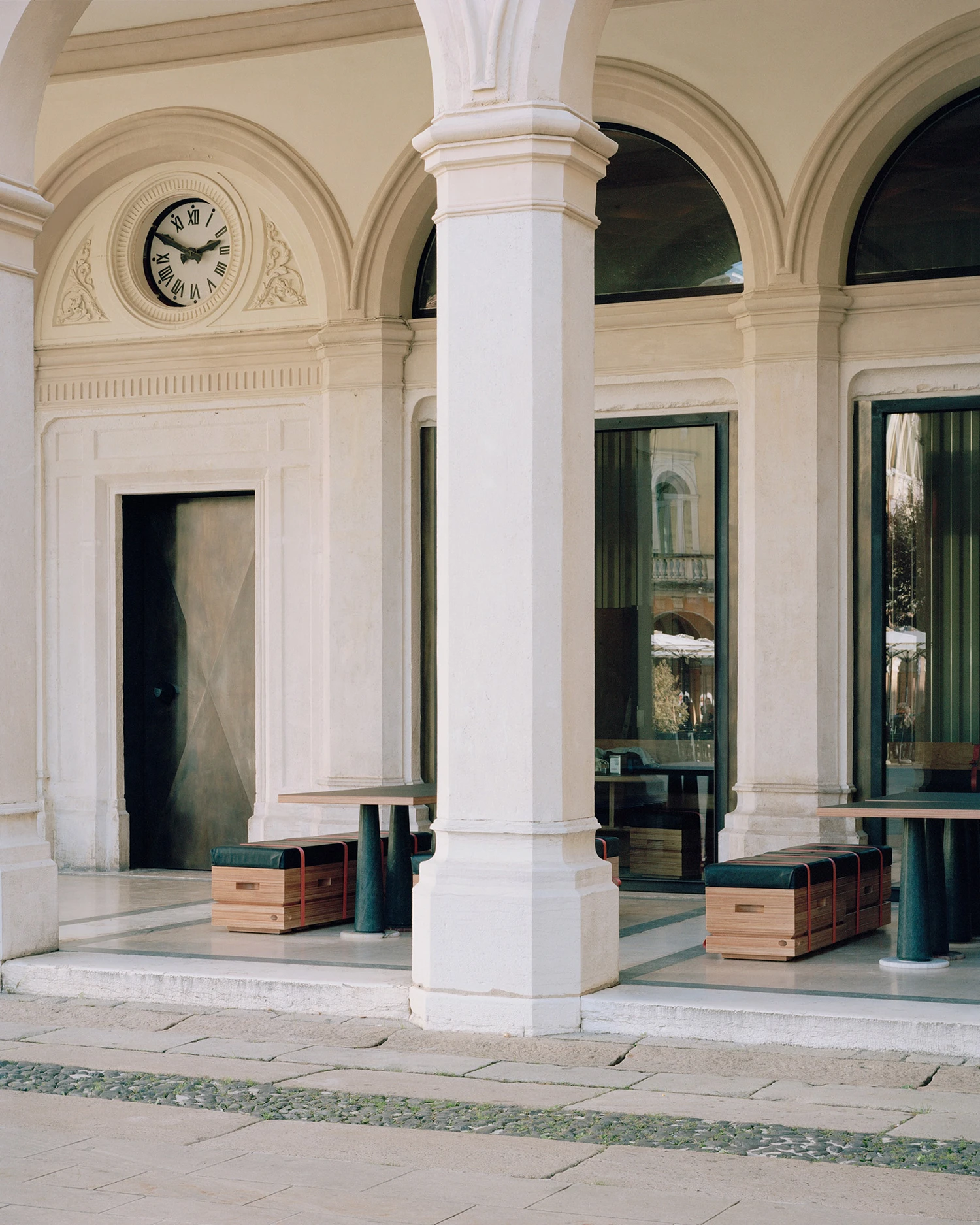 Caffè Nazionale by AMAA in Arzignano Italy, adaptive reuse of 19th-century palazzo with pleated stainless steel walls, okumè plywood ceiling and preserved historical patinas