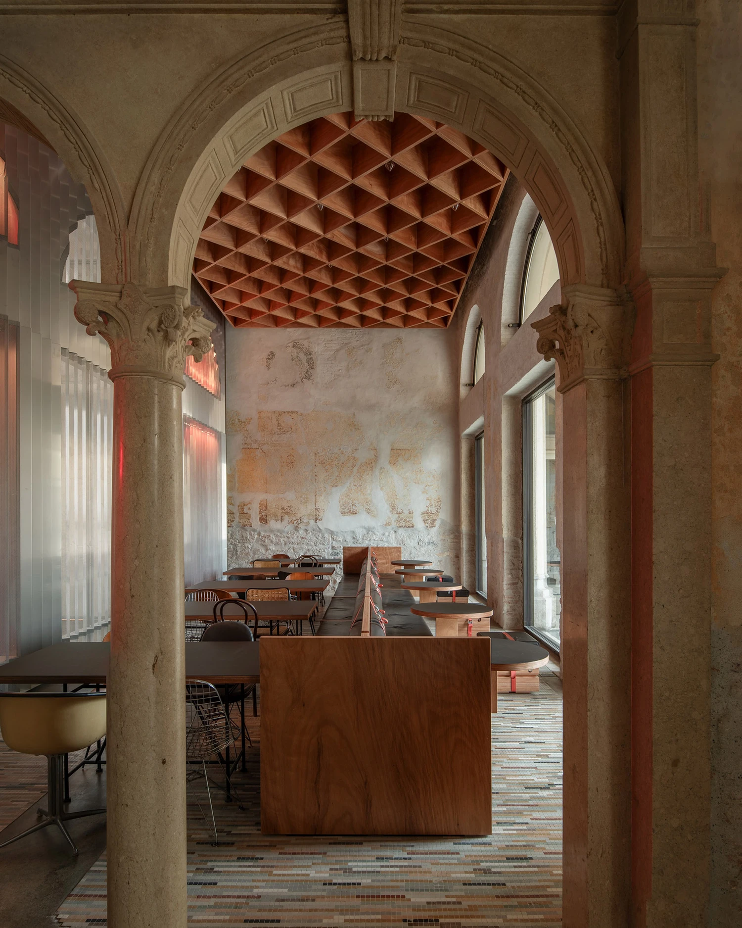 Caffè Nazionale by AMAA in Arzignano Italy, adaptive reuse of 19th-century palazzo with pleated stainless steel walls, okumè plywood ceiling and preserved historical patinas