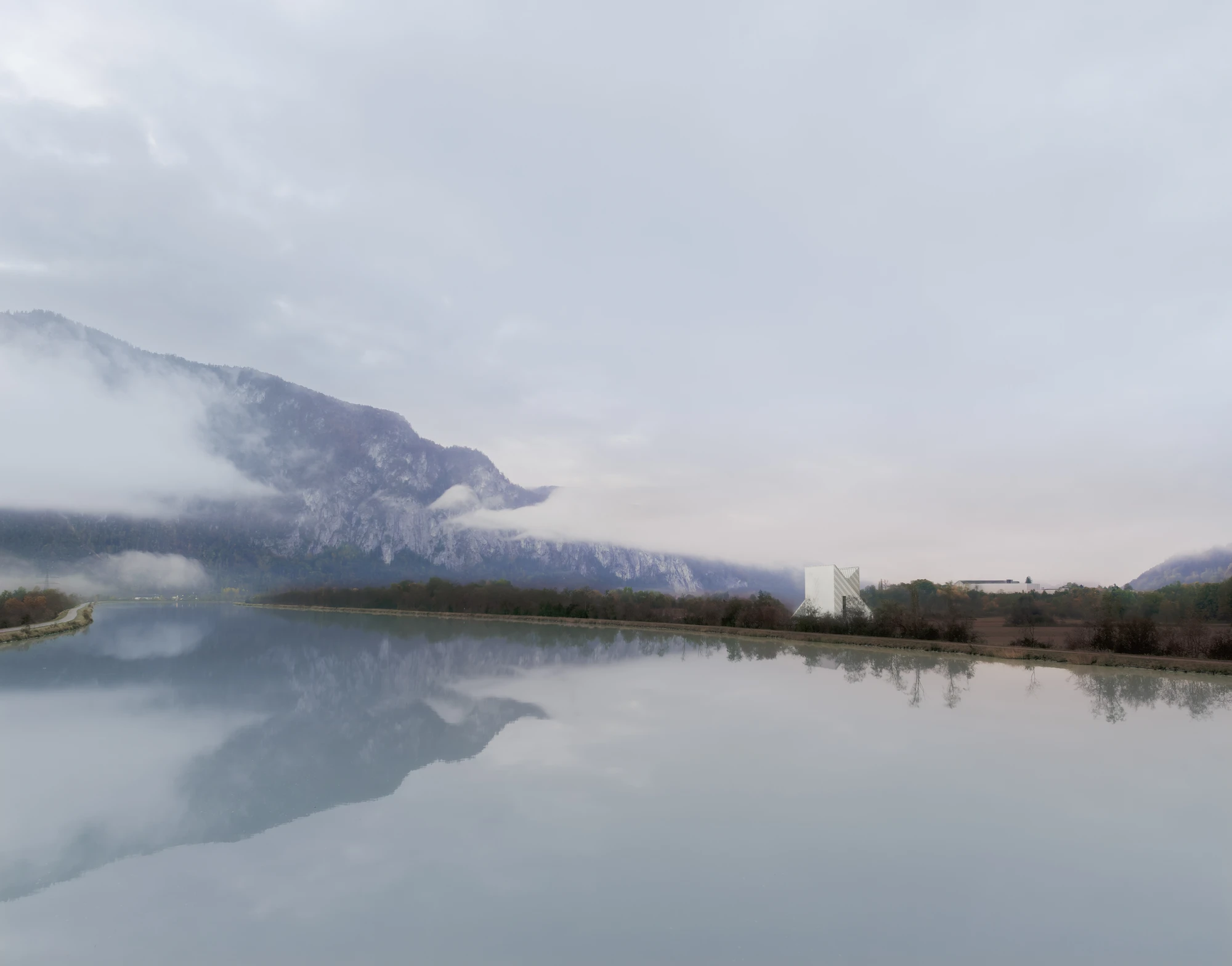 Dynafit Headquarters Speedfactory by Barozzi Veiga in Kiefersfelden Germany, twin pyramidal corporate building with diagonal metal lattice facade set against alpine landscape