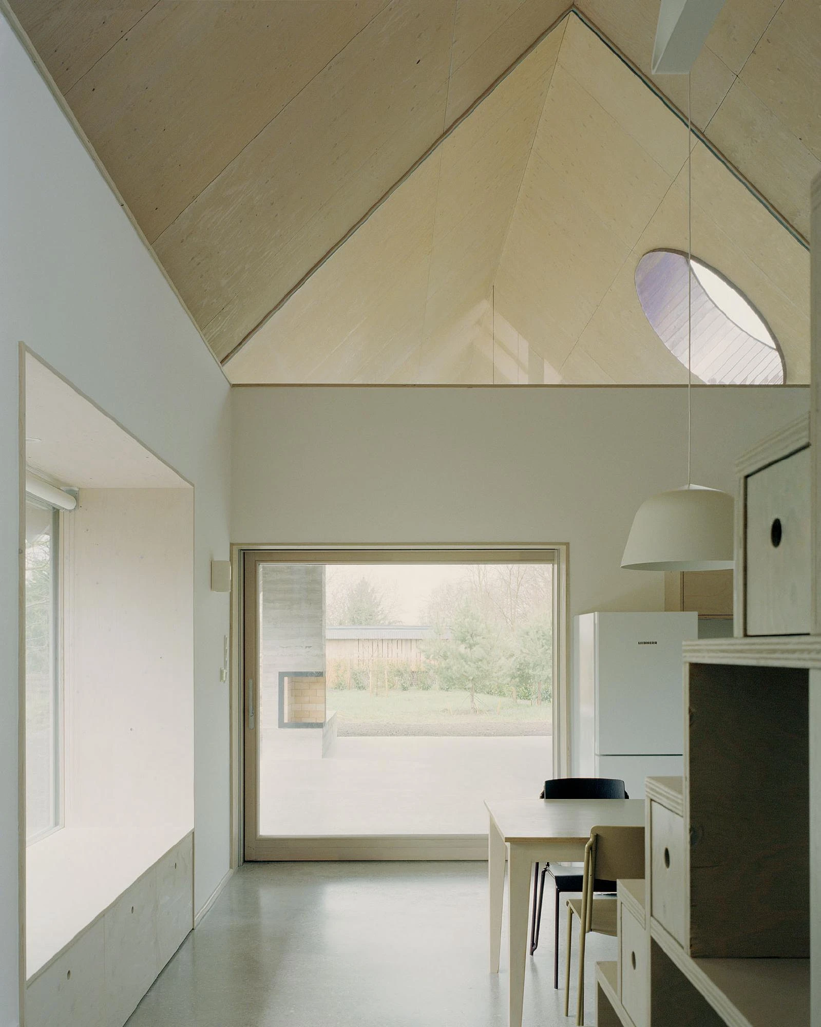 House and Beeyard by OKKA Architects, Western Hungary, rammed concrete, stone, wooden shingles, rural architecture
