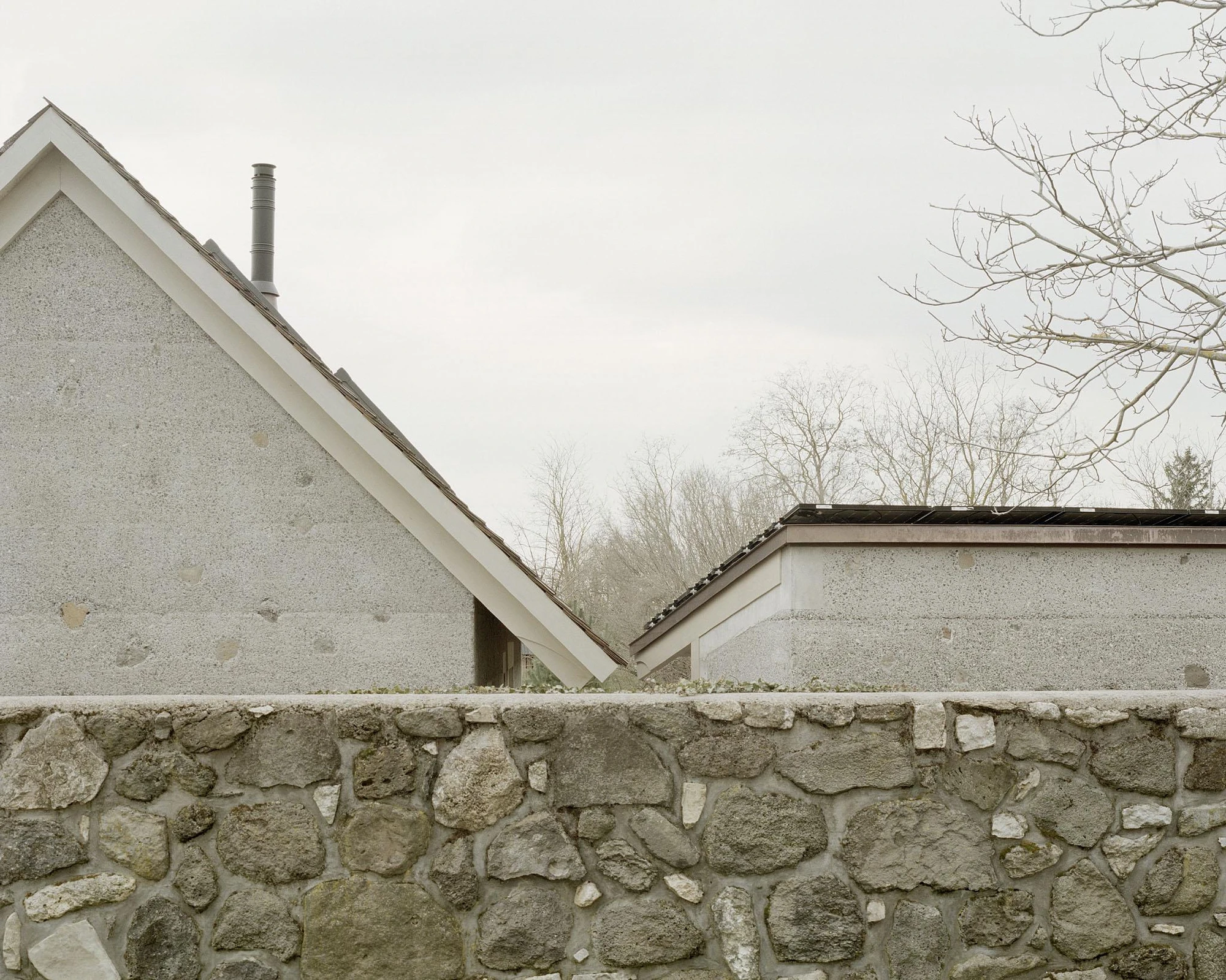 House and Beeyard by OKKA Architects, Western Hungary, rammed concrete, stone, wooden shingles, rural architecture