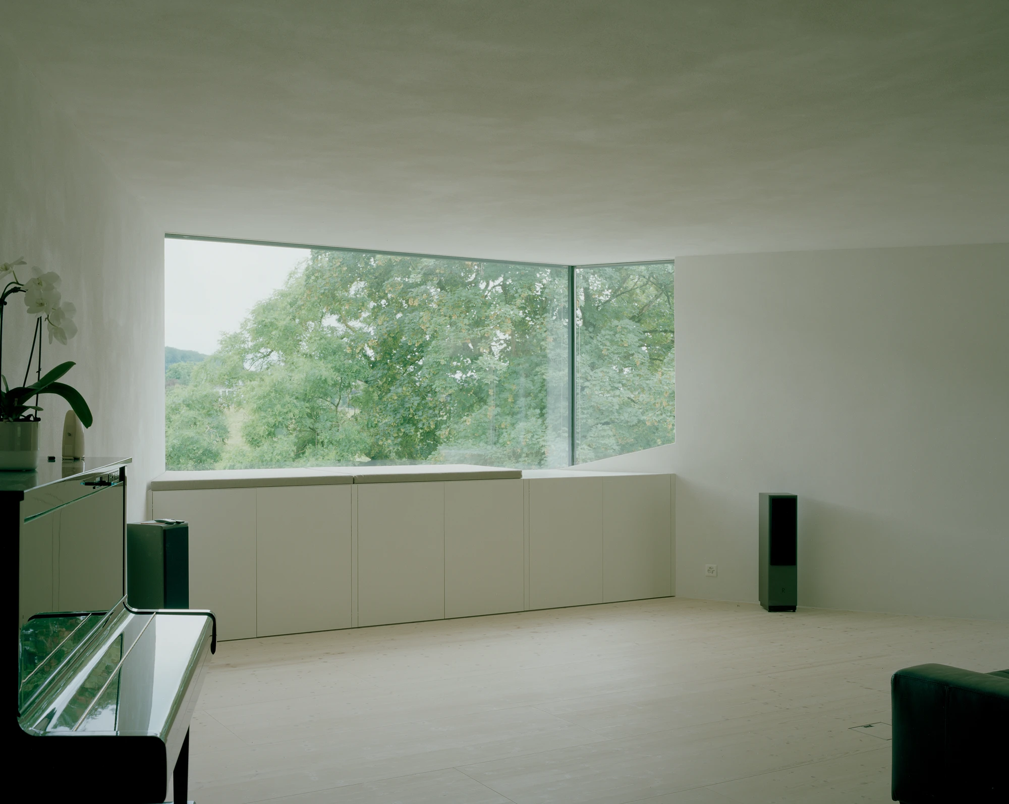 Attic Conversion in Riehen by Raeto Studer Architekten near Basel Switzerland, 1969 house renovation with black oiled cupboards soundproofed studio box clay plaster and PV roof