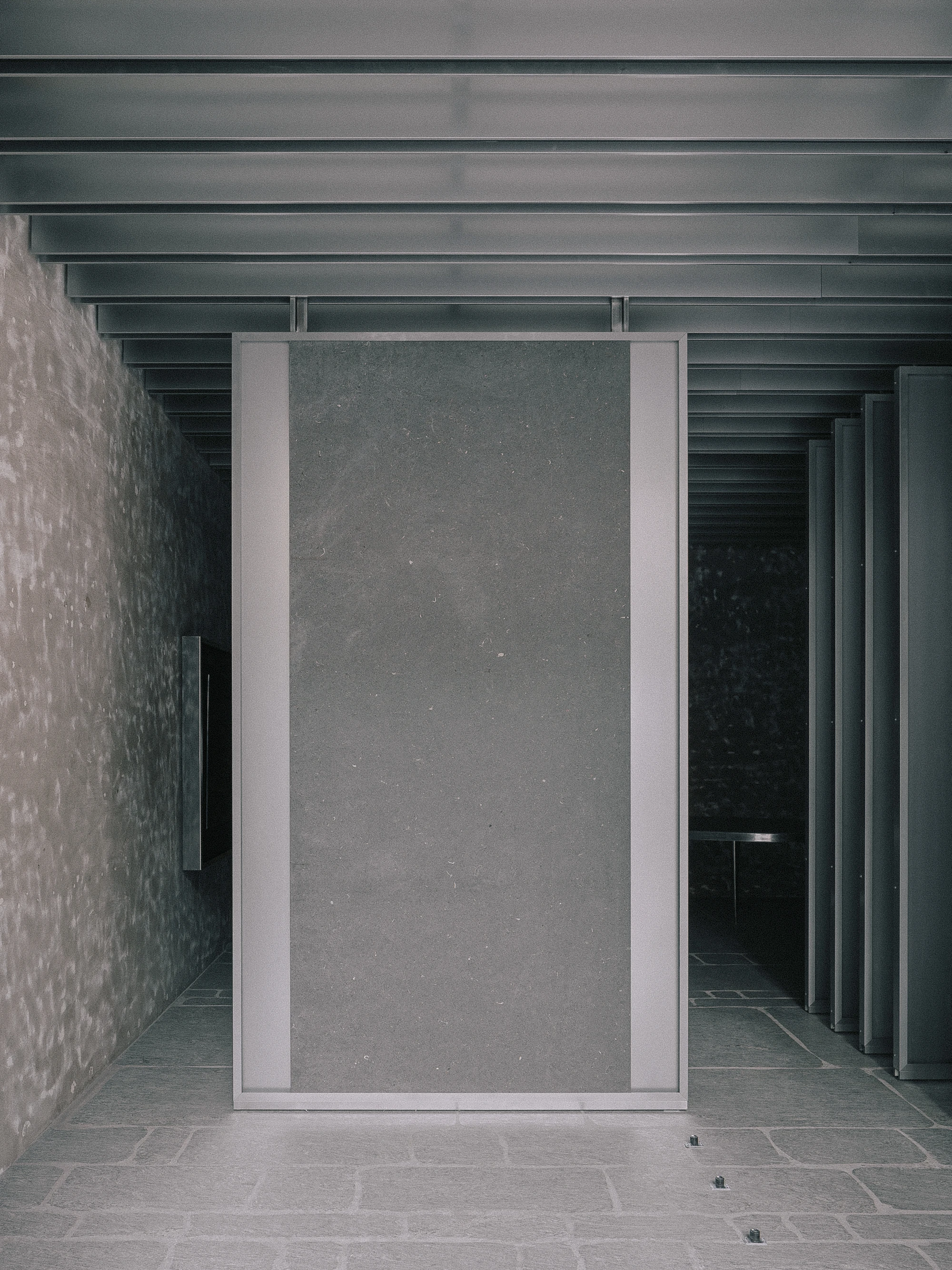 ST01 Flagship Store Seoul, South Korea, stone showroom, Lee Yongbaek, palladiana floor, rail-mounted panels, interiors