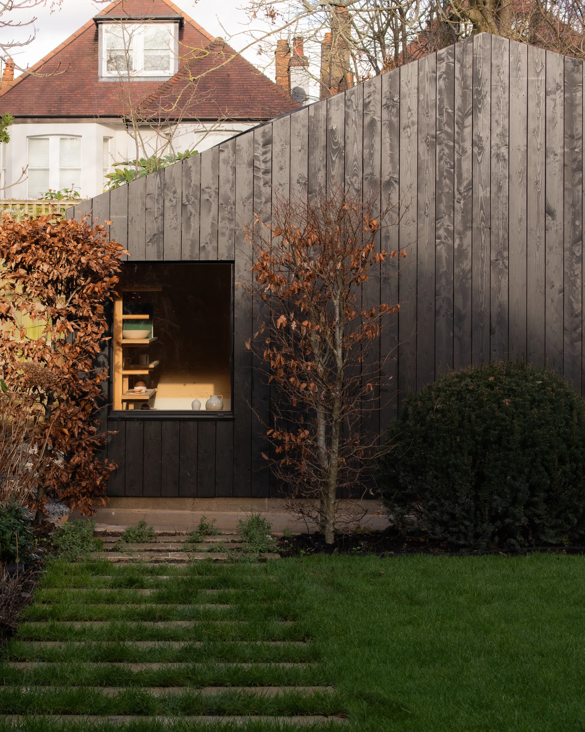 A Potter's Studio by Piercy&Company, North West London, UK, garden studio, timber, circular oculus, pottery workshop