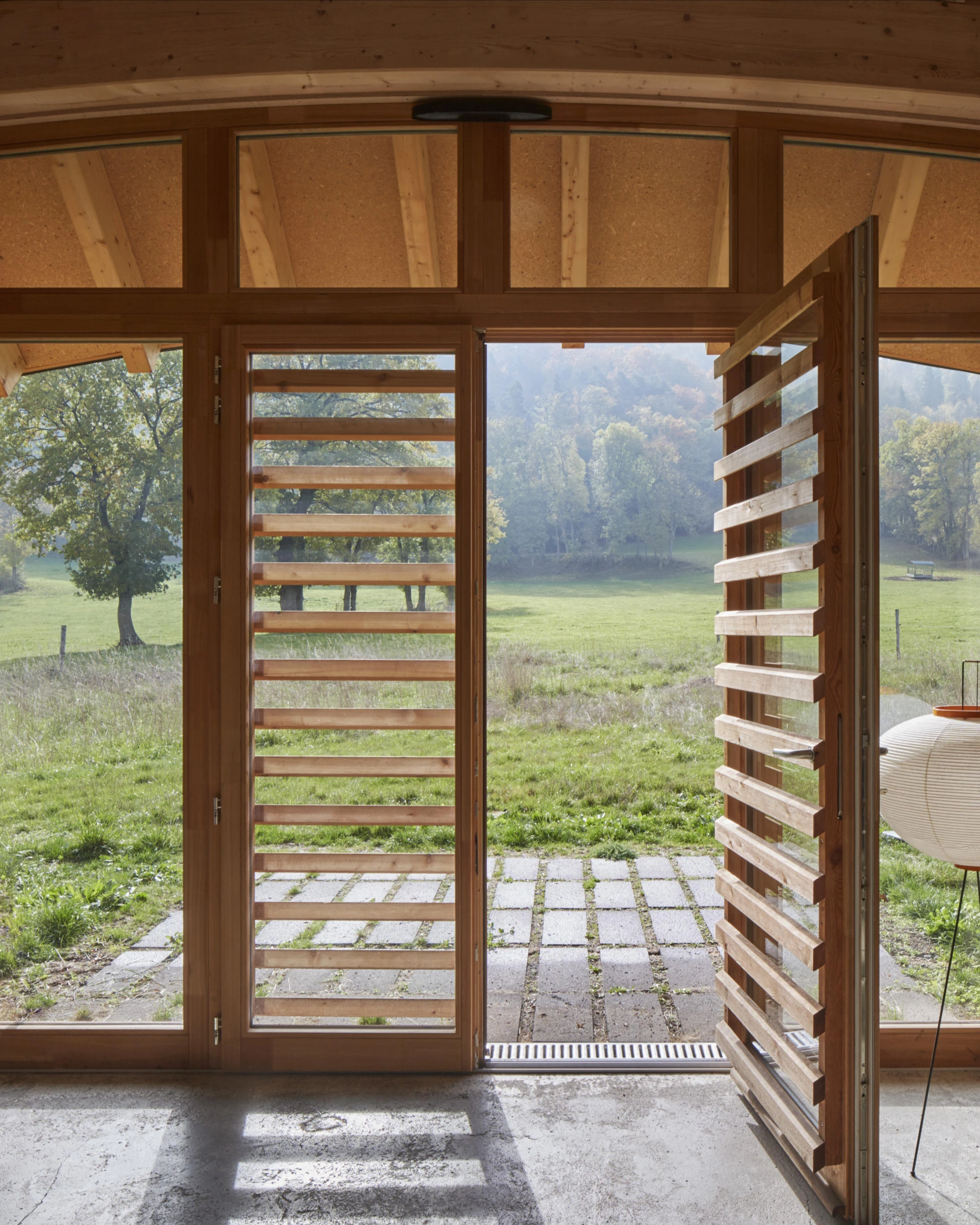 L'Onde house by arba architecture, Murat Cantal France, larch cladding zinc wave roof, rural architecture