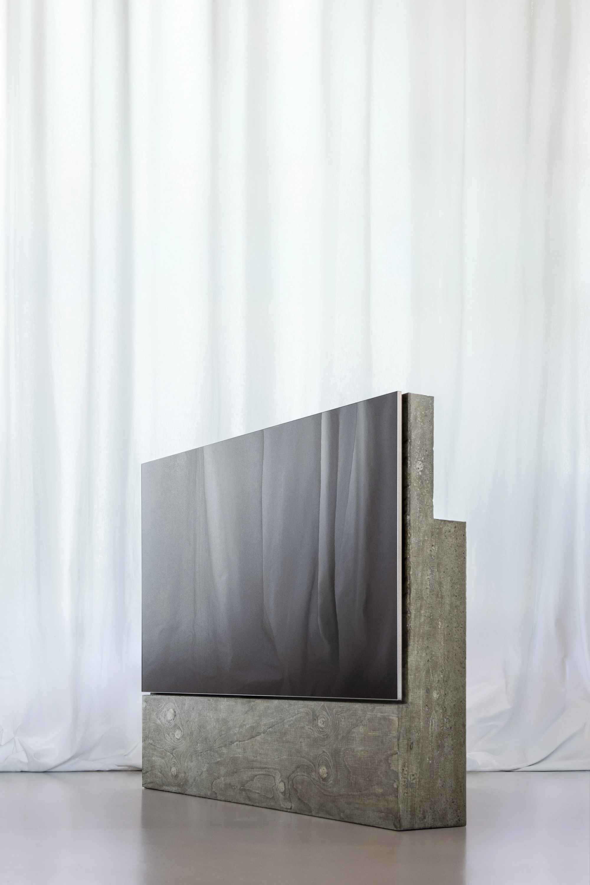 Concrete TV Stand by David Bard — David Bard's television stand inverts the hierarchy of domestic display furniture.