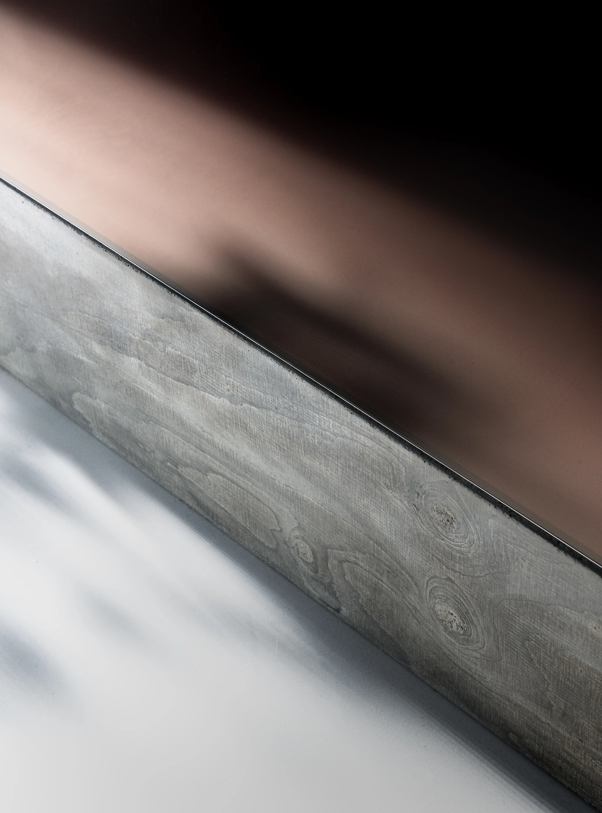 Concrete TV Stand by David Bard — Detail photograph of the Concrete TV Stand's lower structure, capturing the junction between polished concrete base and timber-textured support.